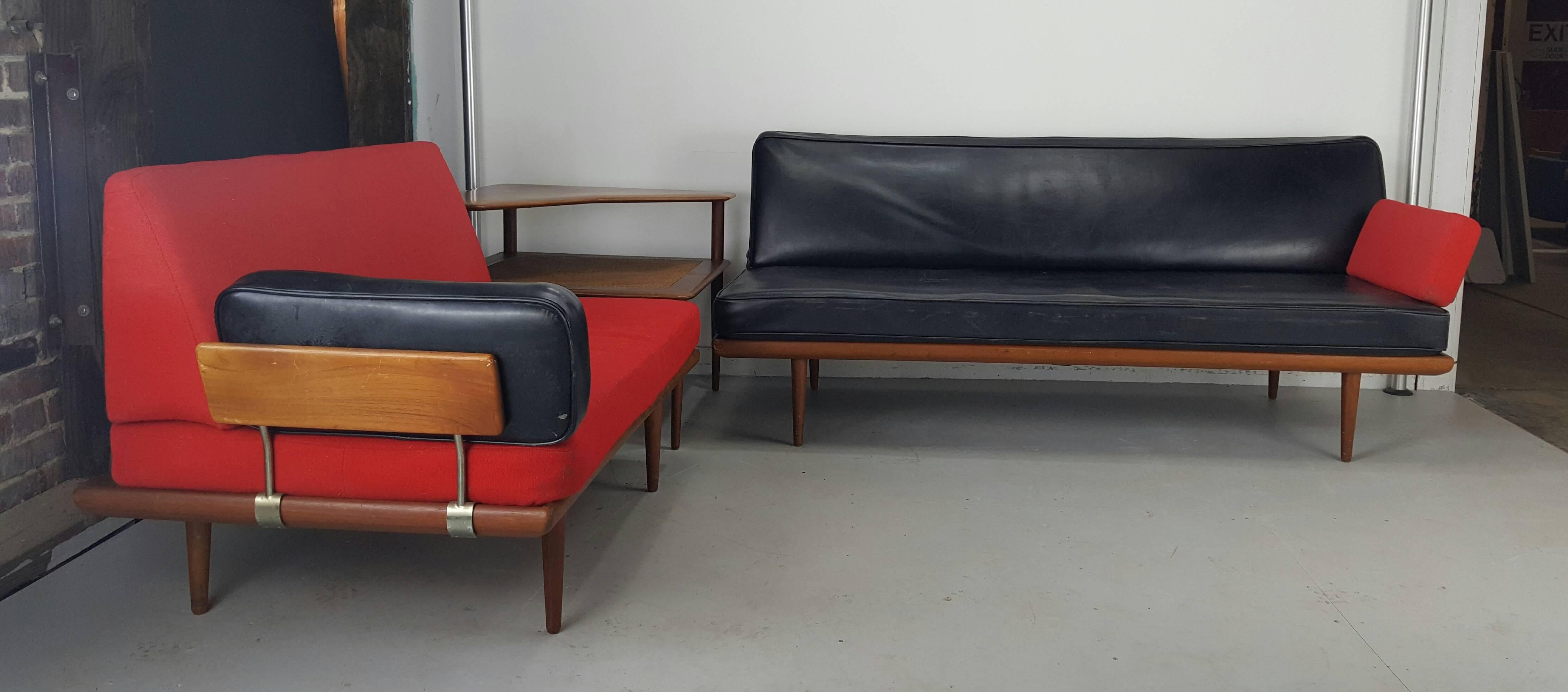 Minerva lounge sofas set designed by Peter Hvidt & Orla Mølgaard-Nielsen with two teak daybeds and a caned corner table.

Produced by France & Son in the 1960s, Denmark.

Three-seat retains original black vinyl two-seat red wool fabric, minor