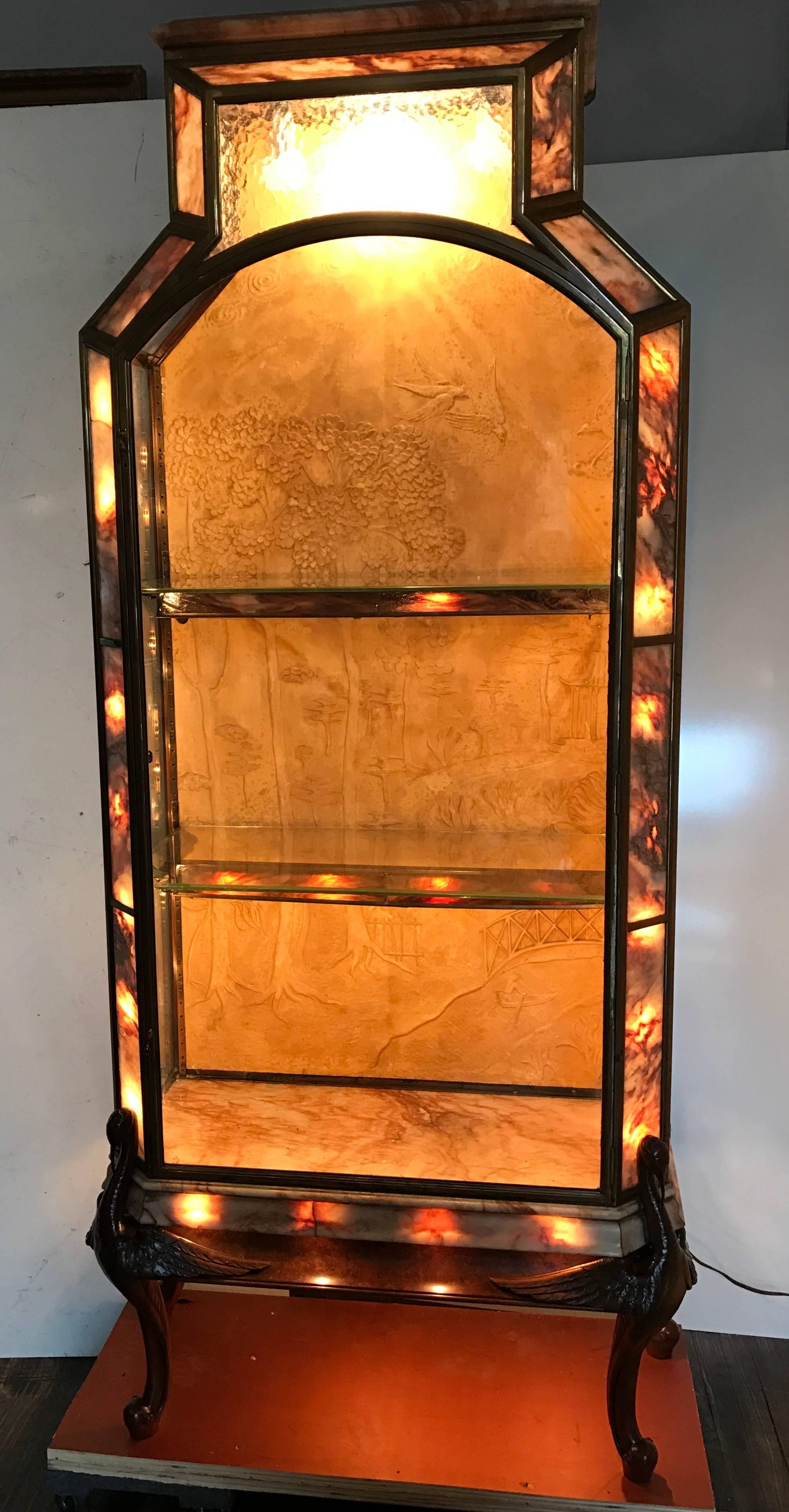 Early 20th century French Art Deco Vitrine. Display cabinet, salvaged from super high end jewelry or gift gallery in New York City. Superior quality and construction. Tiffany quality, bronze frame, machined fittings, brass shelf brackets, Stained