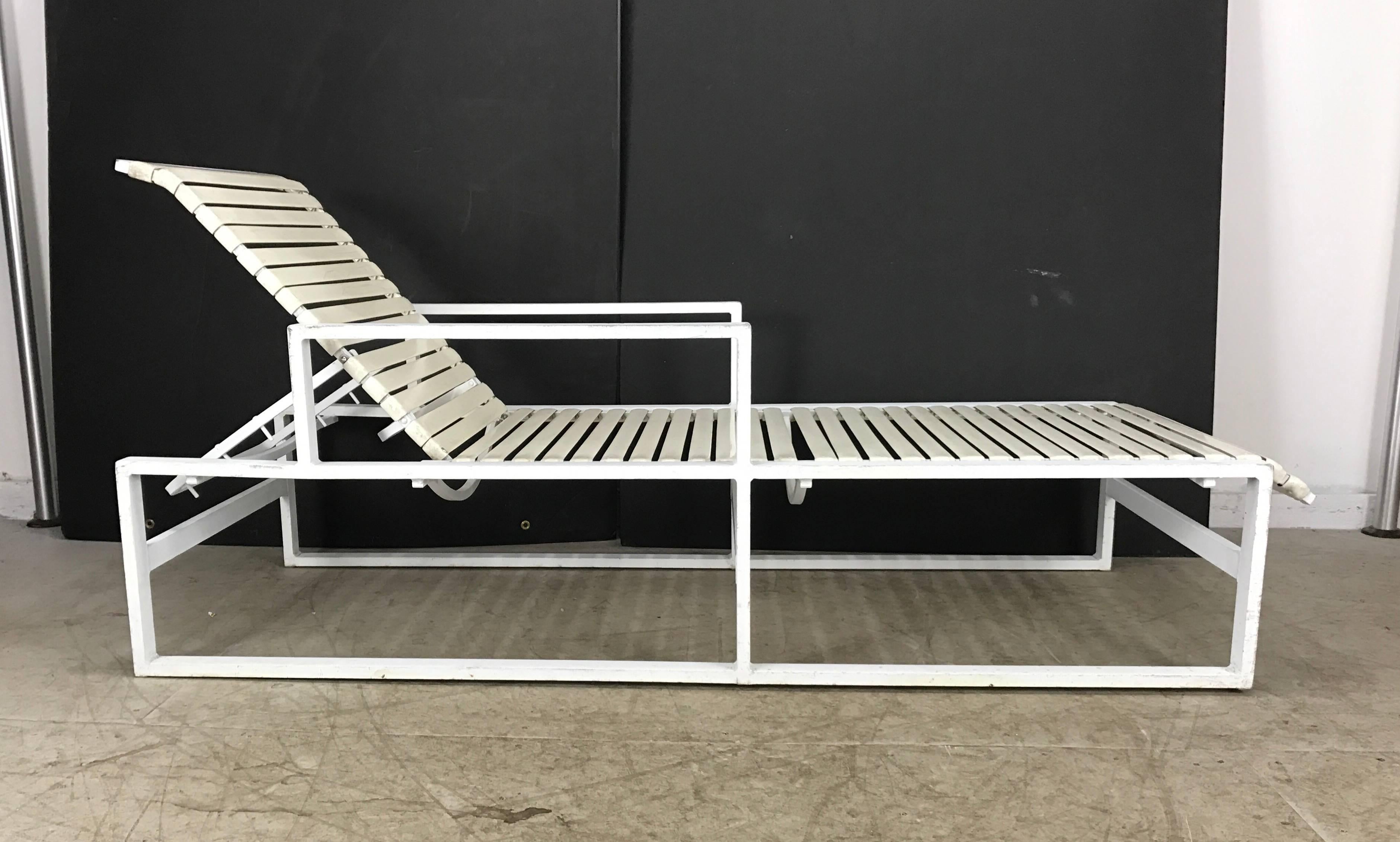 Pair modernist architectural pool side/garden chaise longue's, commercial grade/quality, powder coated aluminum frames, vinyl strapping, four position back. Wonderful sculptural design.