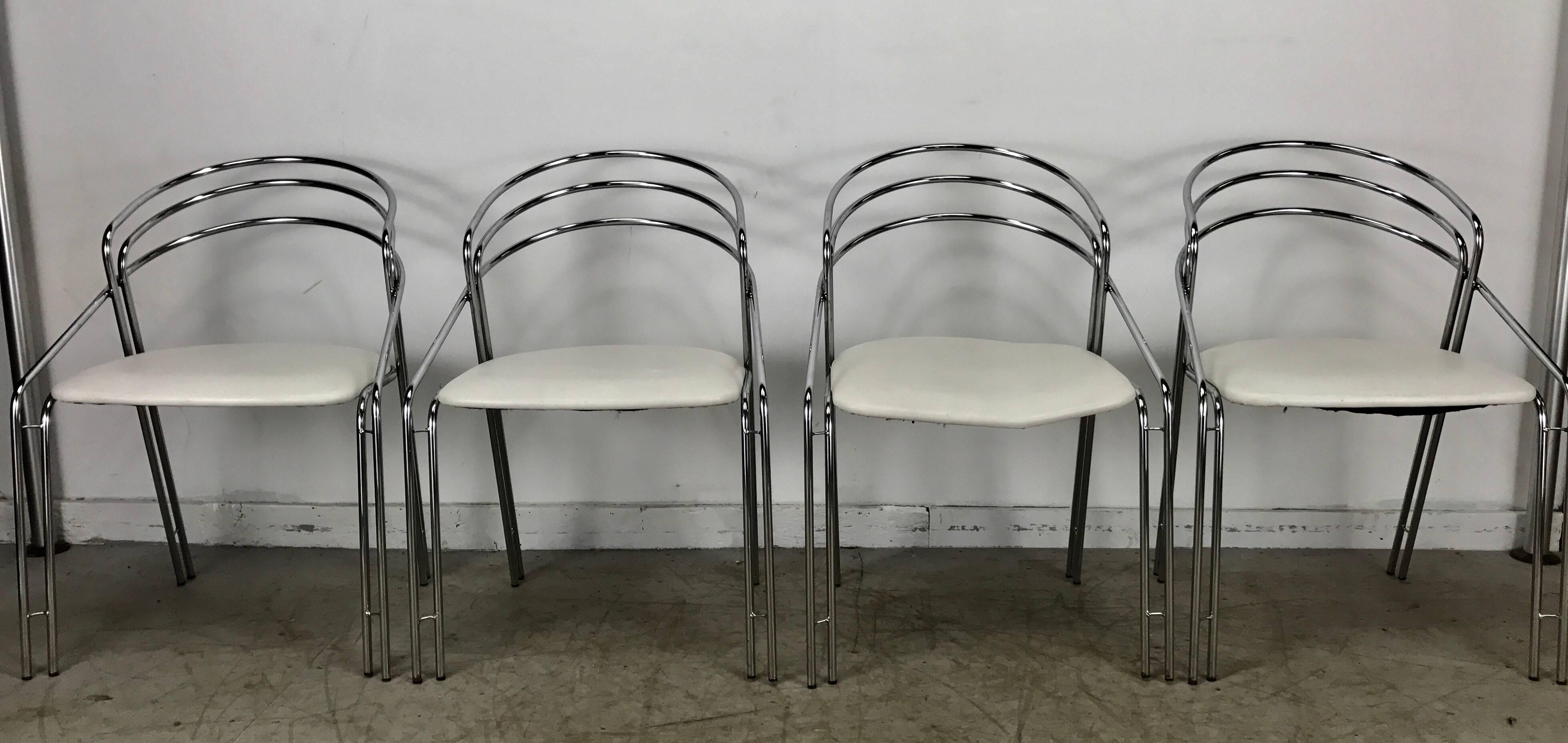 Set of four chromed and bent steel postmodern Italian chairs. Multiple bars of chromed steel with thin chromed steel spacers. Each bar is significant to the design of the chair, making double bar legs with connections to the seat and the back.