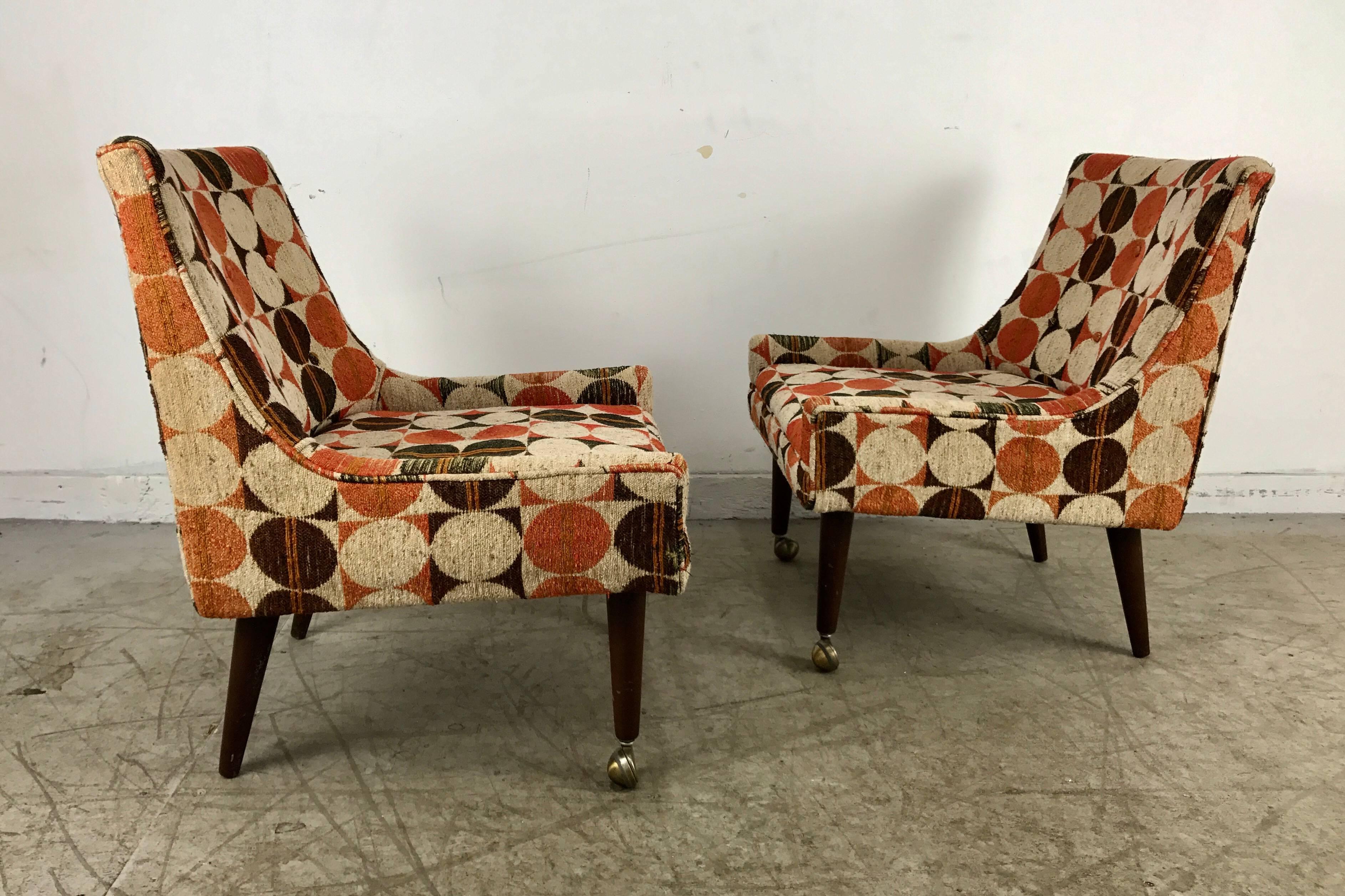 Classic modernist set of four slipper chairs attributed to Harvey Probber. Stunning stylized Space Age geometric fabric by Jack Lenor Larsen. Walnut legs with quality brass fitted casters, nice original condition.




 