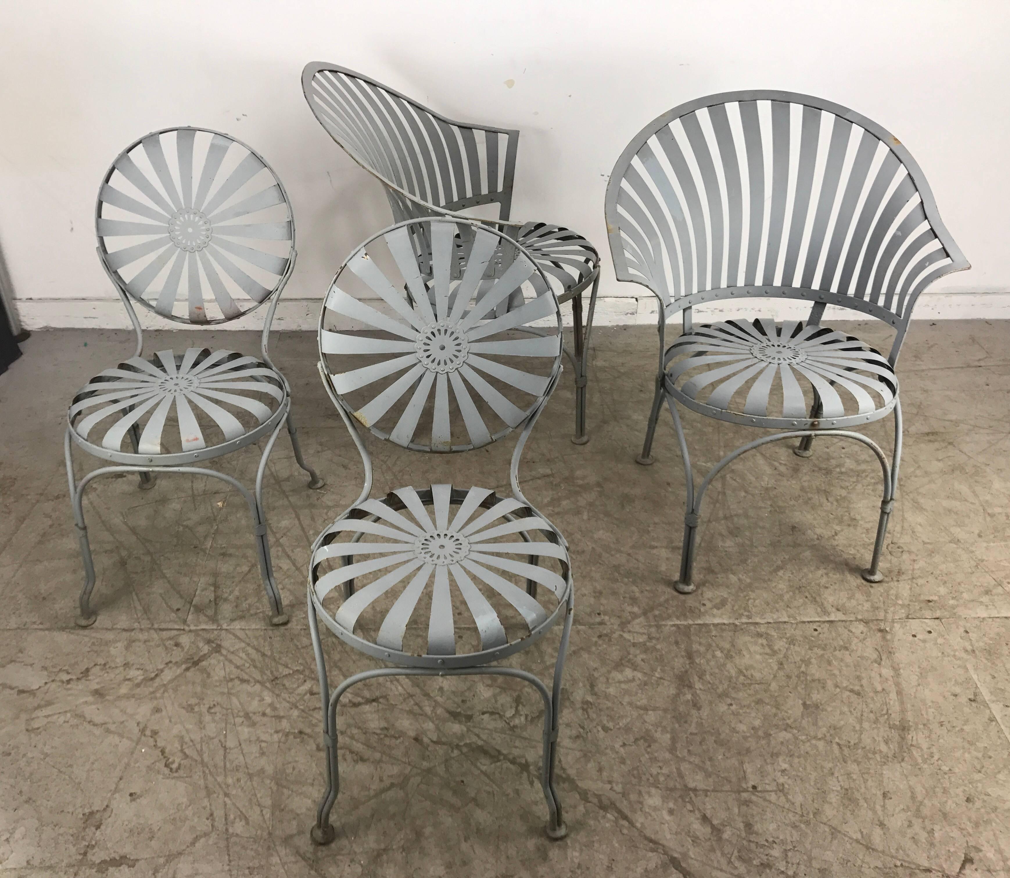 Set of four Francois Carre´ French sunburst garden set featuring two fan back armchairs and two side chairs, Classic design, extremely comfortable.