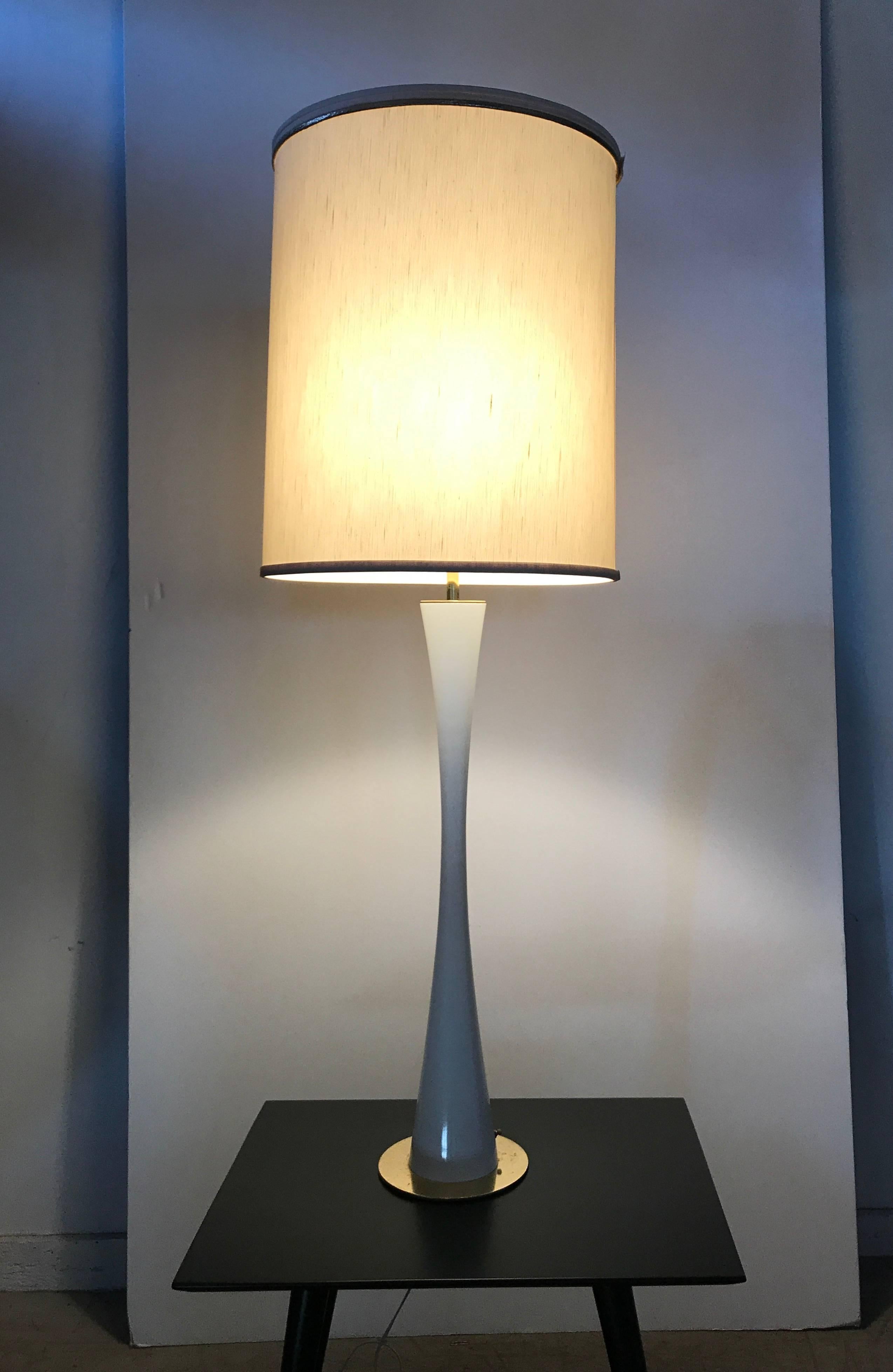 Elegant, sexy extra tall white enamel and brass Hourglass lamp by Stewart Ross James for Hansen, amazing quality and design, Can be used as table or floor lamp measuring 50 inches high, retains original lamp shade. Three-way light function.