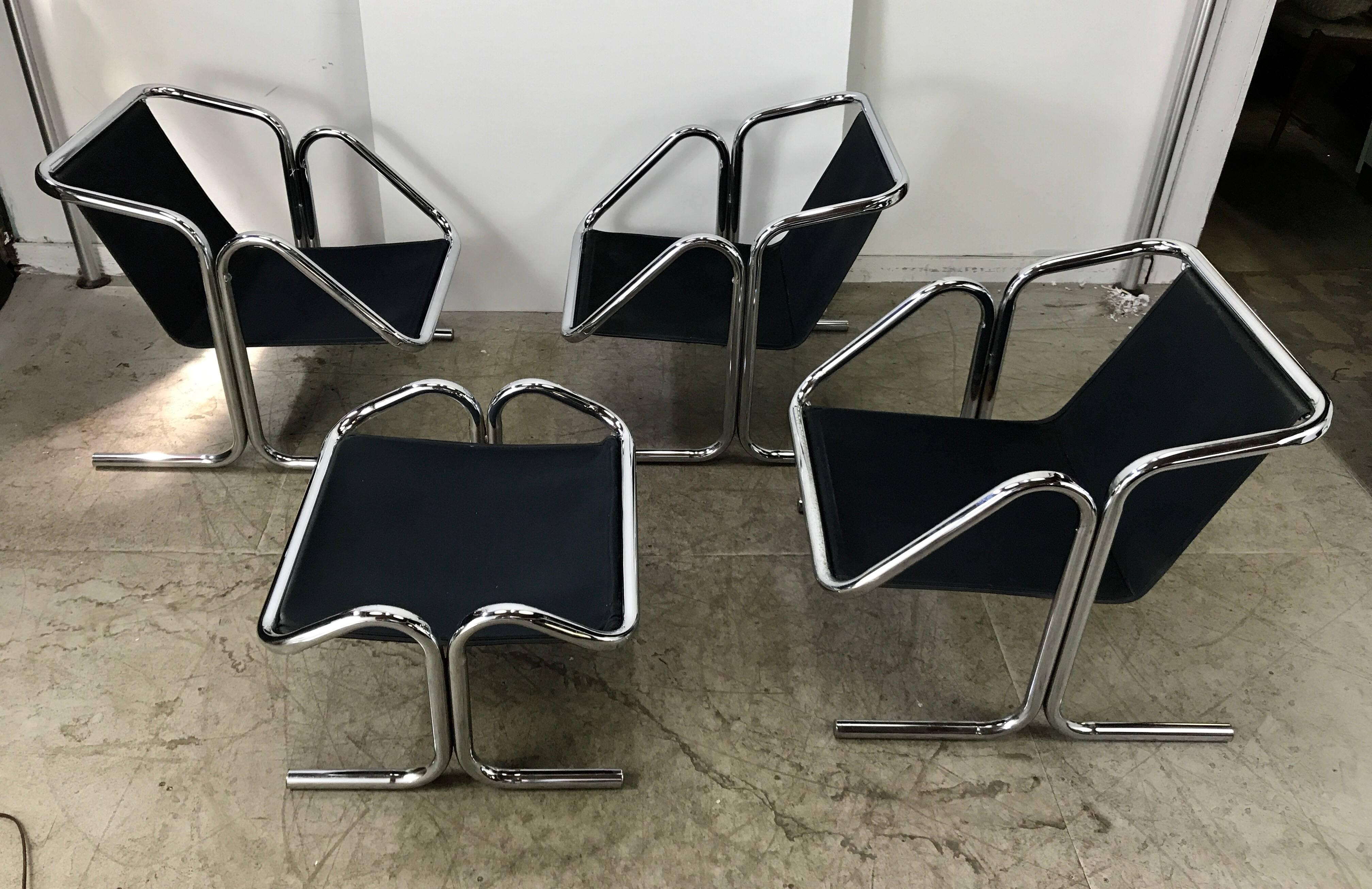 A set of Jerry Johnson Arcadia for Landes Manufacturing Company lounge chairs with chrome frames and black canvas slings. Each chair is made from two bent chrome tubes fused together, Classic 1960s pop modernist seating, Designed by Jerry Johnson