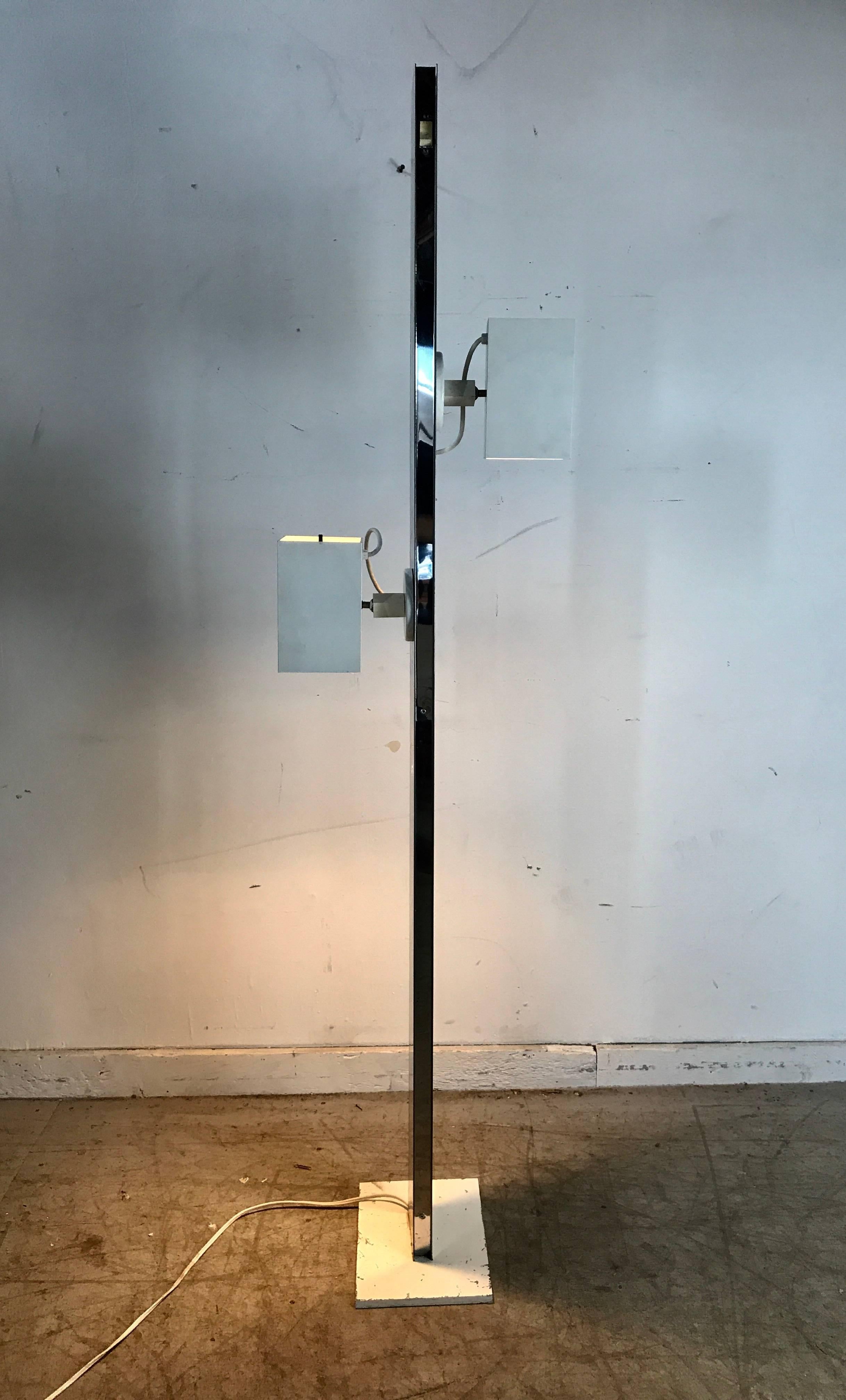 Modernist chromed steel pillar adjustable floor lamp by George Kovacs, 1960s,features chromed steel pillar with two adjustable painted metal architectural fixtures, large magnet design which enables fixtures to move and placed wherever desired,