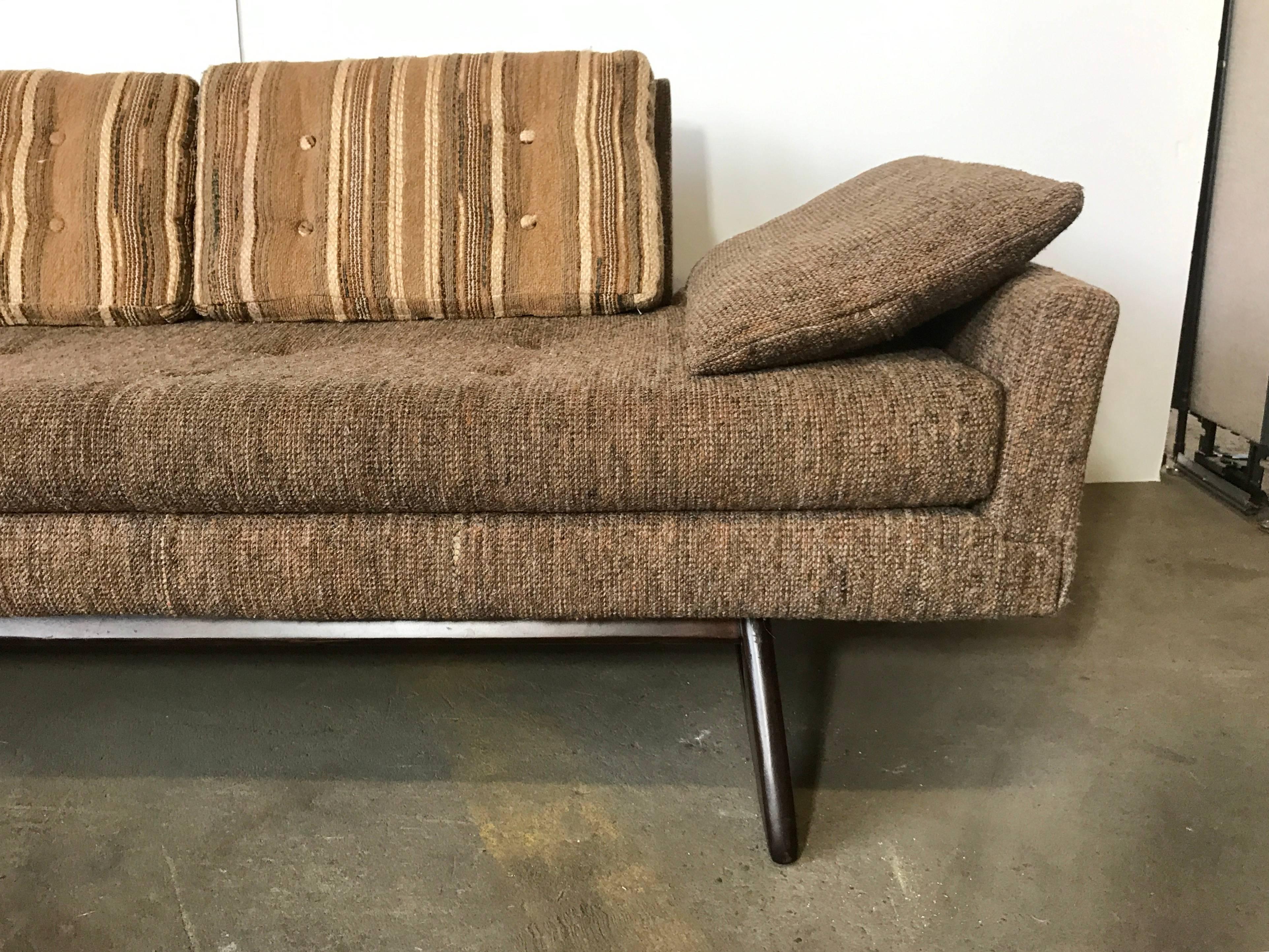 This large Adrian Pearsall sofa features unique sculpted walnut legs and a unique and stylish design, retains its original Mid-Century Modern fabric, nice usable condition. Priced accordingly, perfect reupholster candidate.