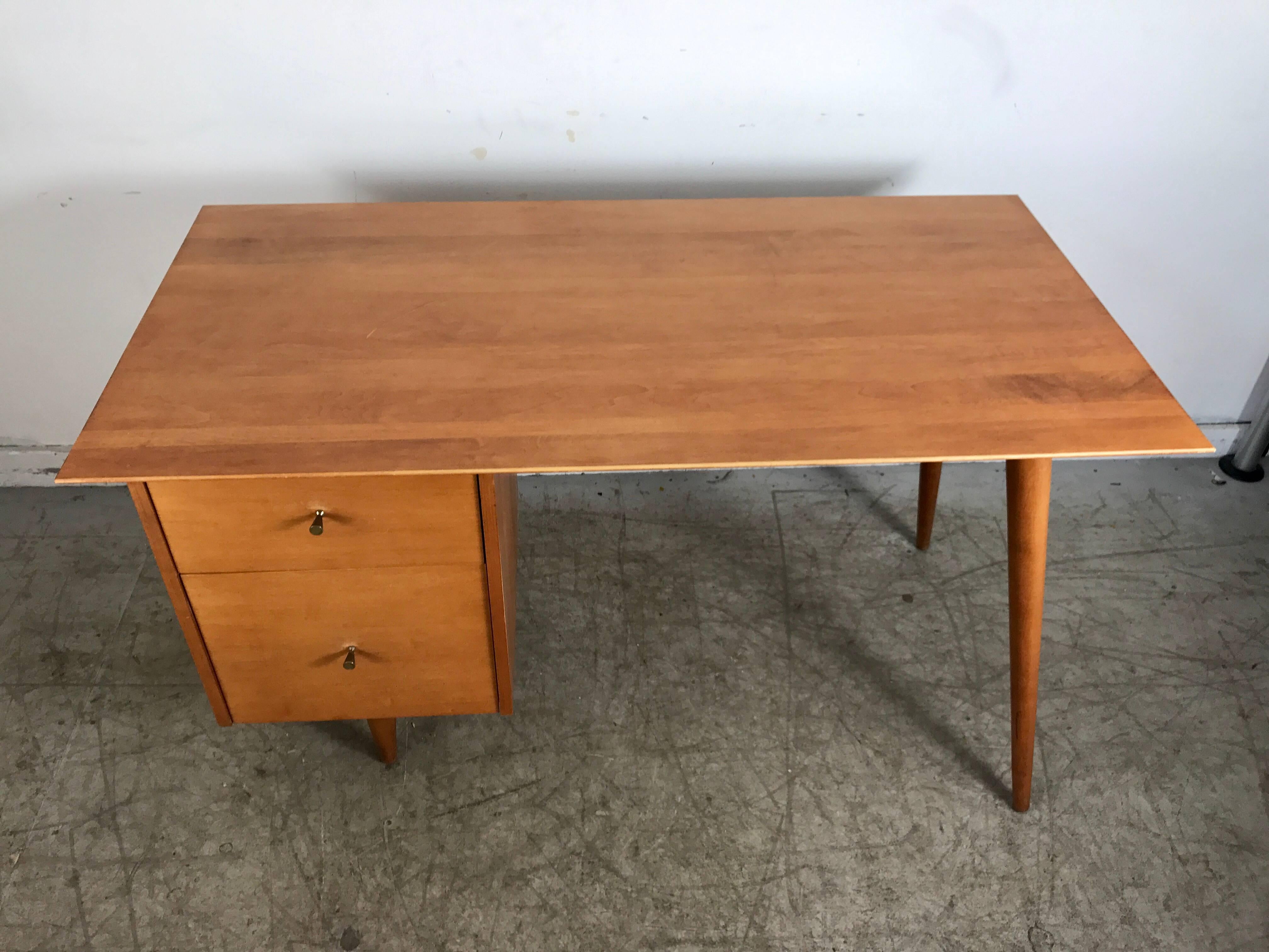 Classic Modernist desk by Paul McCobb, stunning blonde birchwood desk, two drawers on left, file drawer, original brass conical drawer pulls, hand delivery avail to New York City or anywhere en route from Buffalo NY.