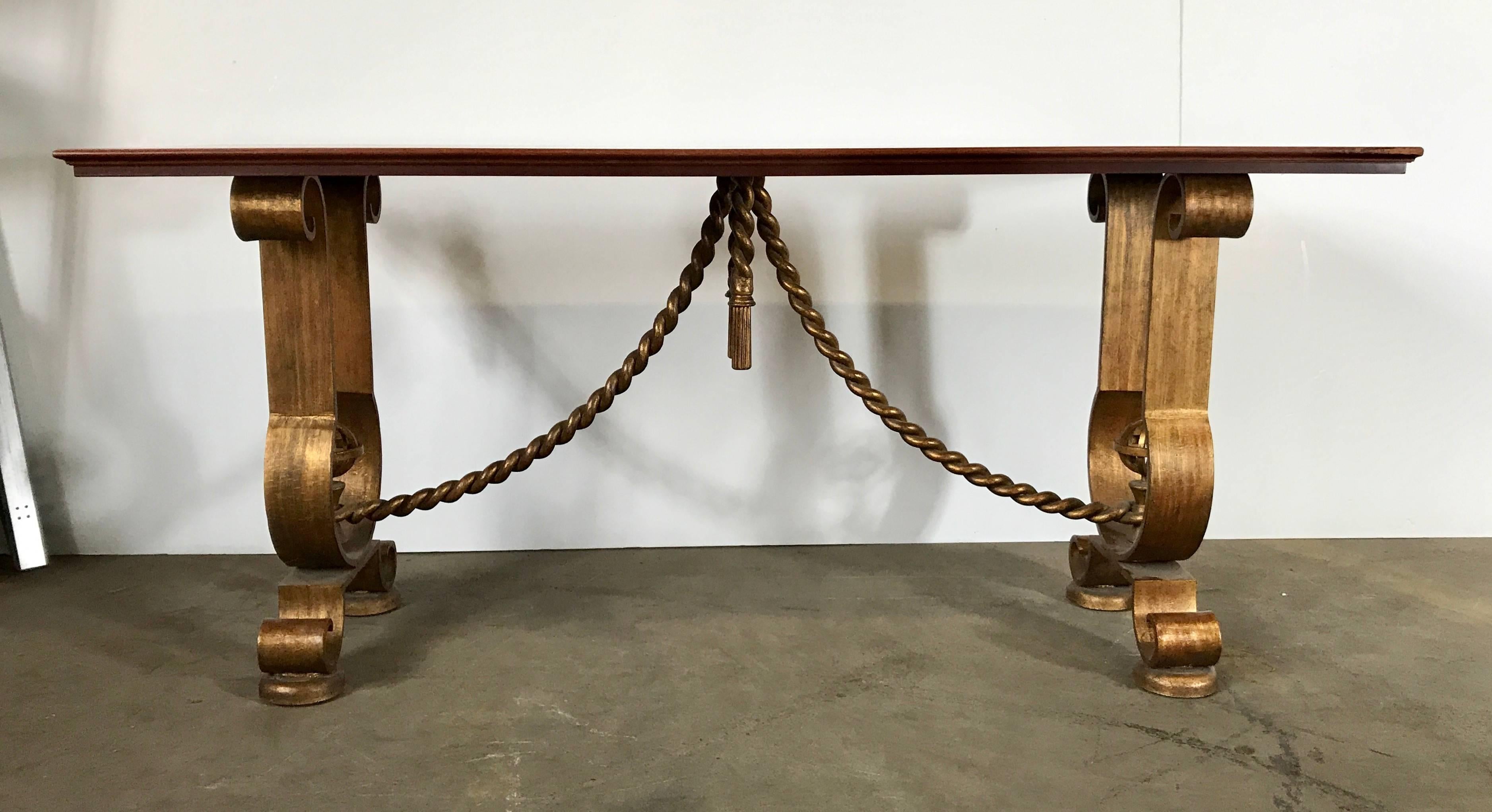 Pair of French gold gilt console tables Murray's Iron Works manner of G. Poillerat. Classic design, wonderful gold gilding, restored wood tops, hand delivery avail to New York City or anywhere en route from Buffalo New York.