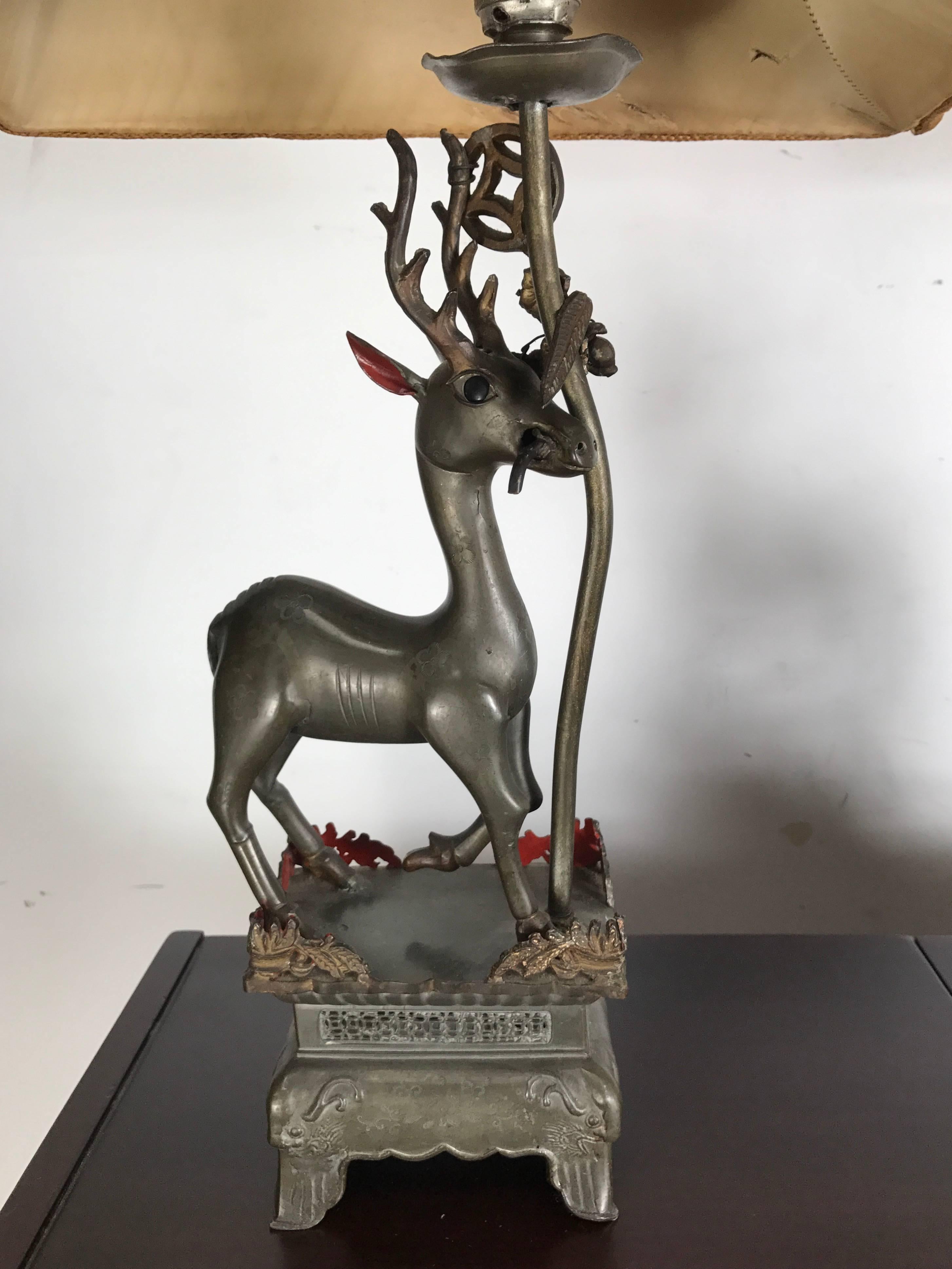 Charming pair of Antique Chinese Pewter Gazelle themed table lamps, Original antique oil lamp converted to electric in the early 20th century, Wonderful bronze color and patina. Hand chased, etched, decorated and painted, Amazing detailing, Retains