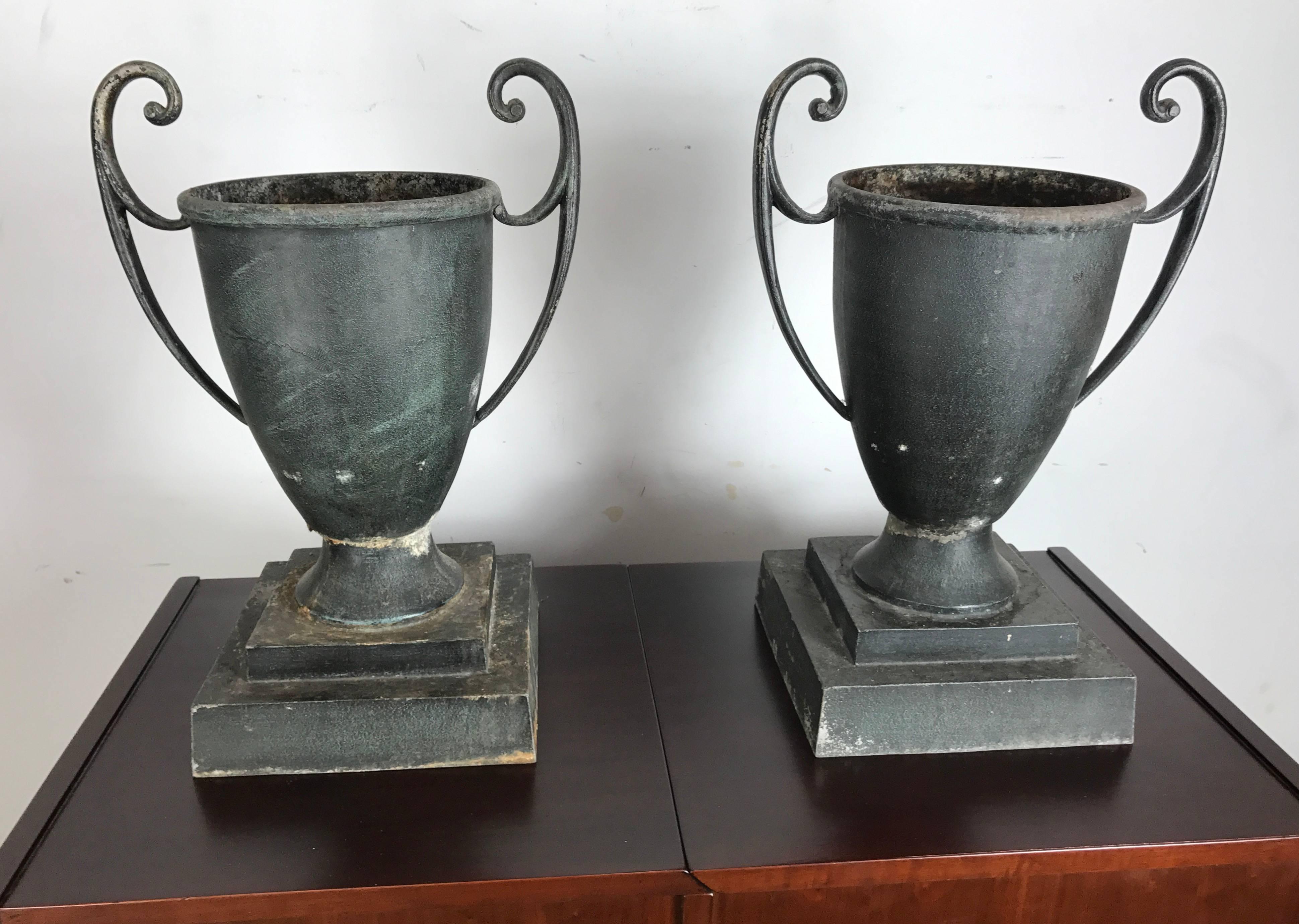 Classic, 1920s cast aluminum art deco handled urns or planters exquisite form. Retains original distressed patina.