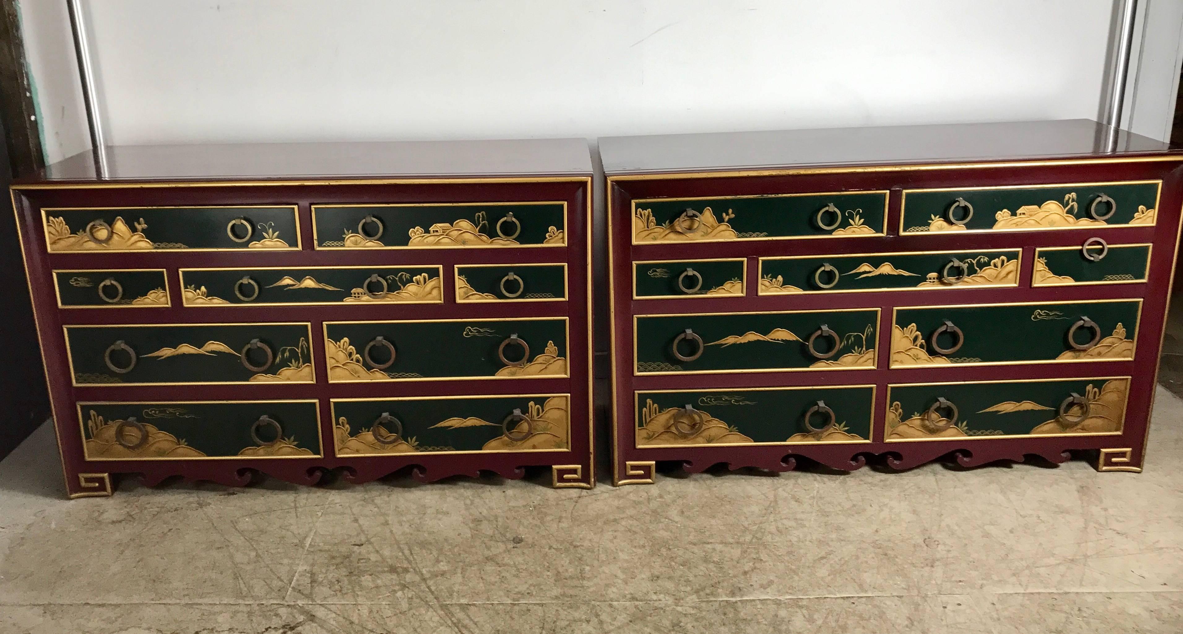 Pair of highly decorated lacquered nine-drawer chests or dressers, Stunning Japanese themed motif featuring burgundy and hunter green lacquer with gold relief detailing, solid brass graduated hand pulls, amazing quality and construction, attributed