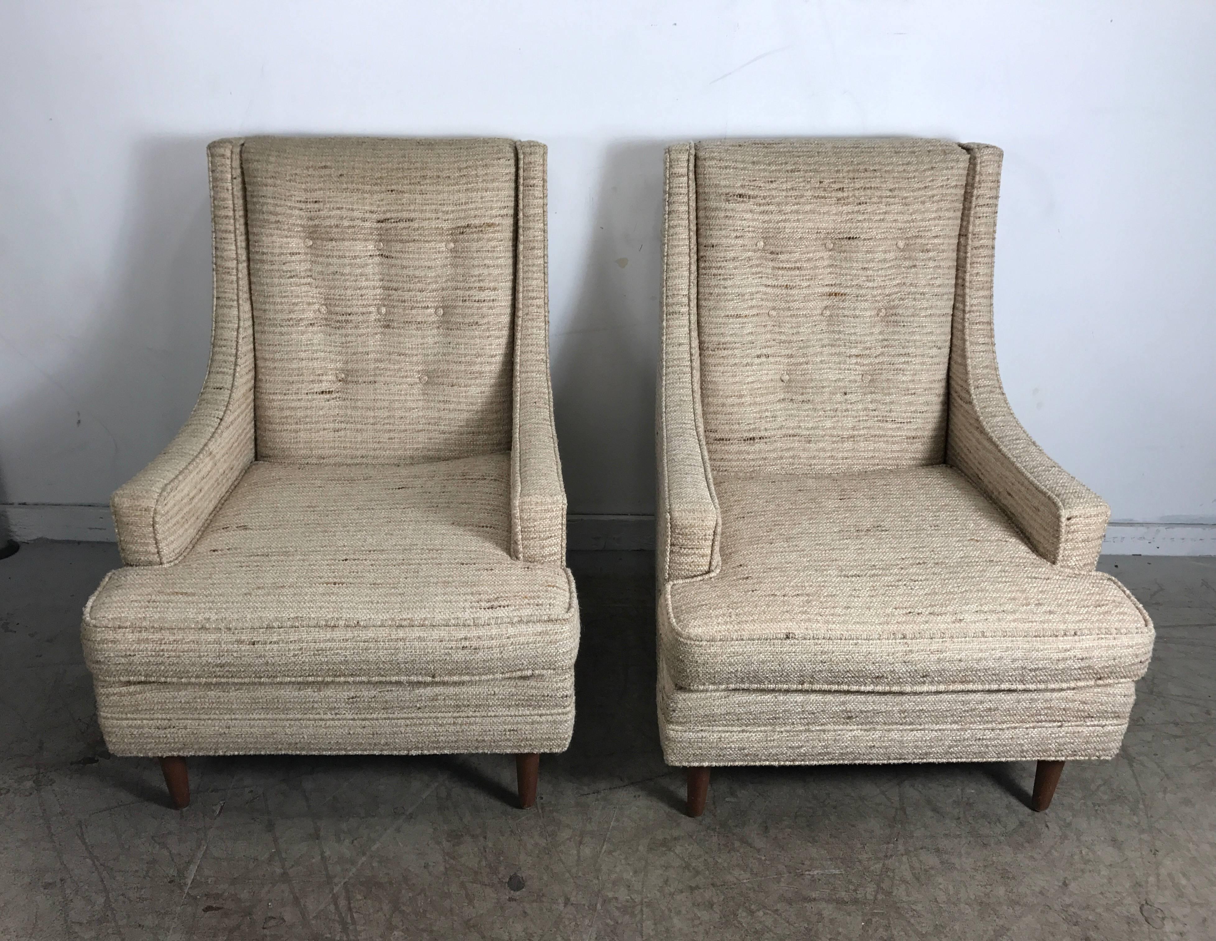 Classic Mid Century Modern Highback Lounge Chairs in the manner of Harvey Probber. Extremely comfortable,Superior quality and construction. Retains original fabric.