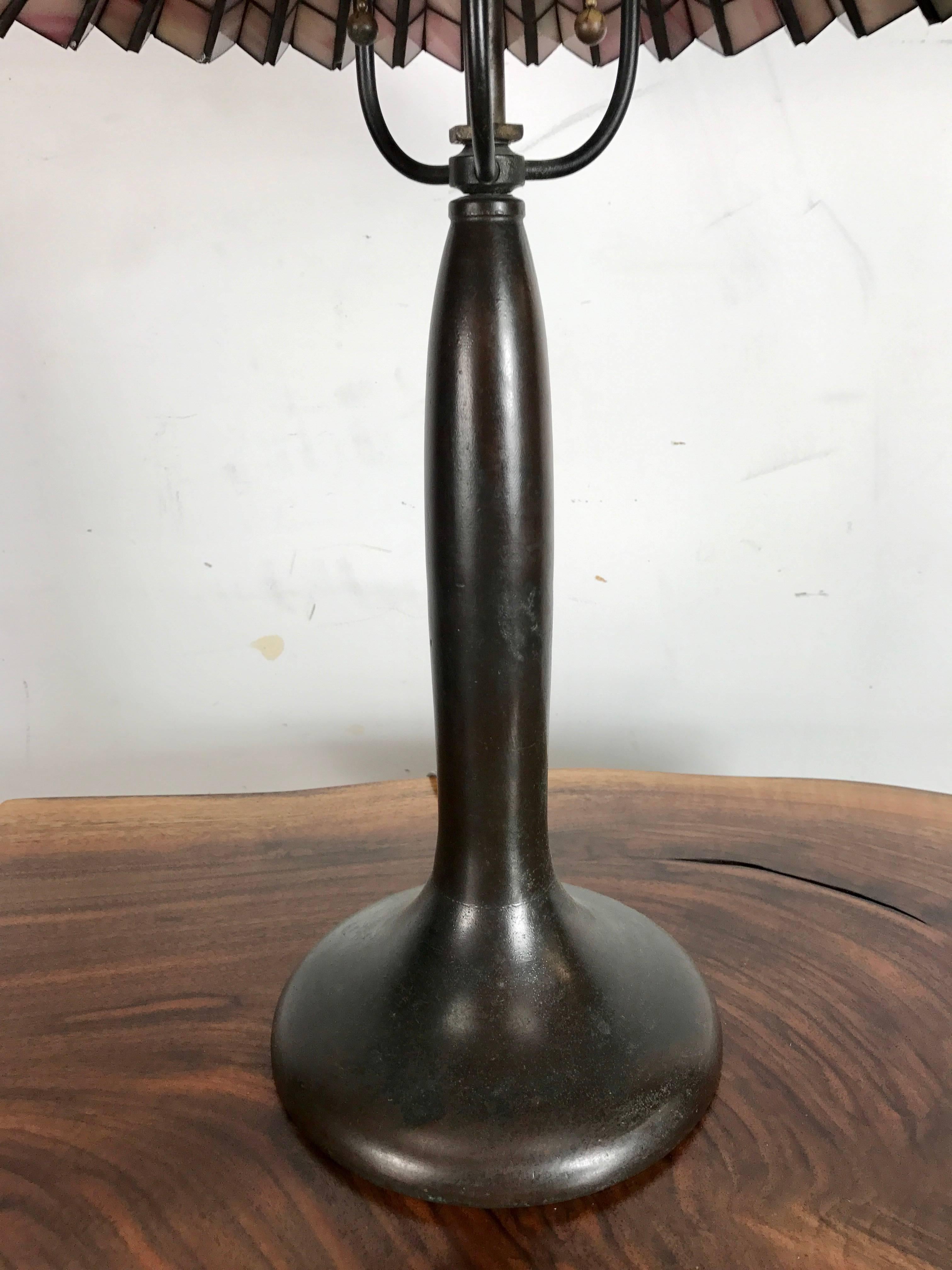 Early Arts and Crafts bronze lamp base by Handel, wonderful verde patina, Classic form. Retains raised Handel mark.
