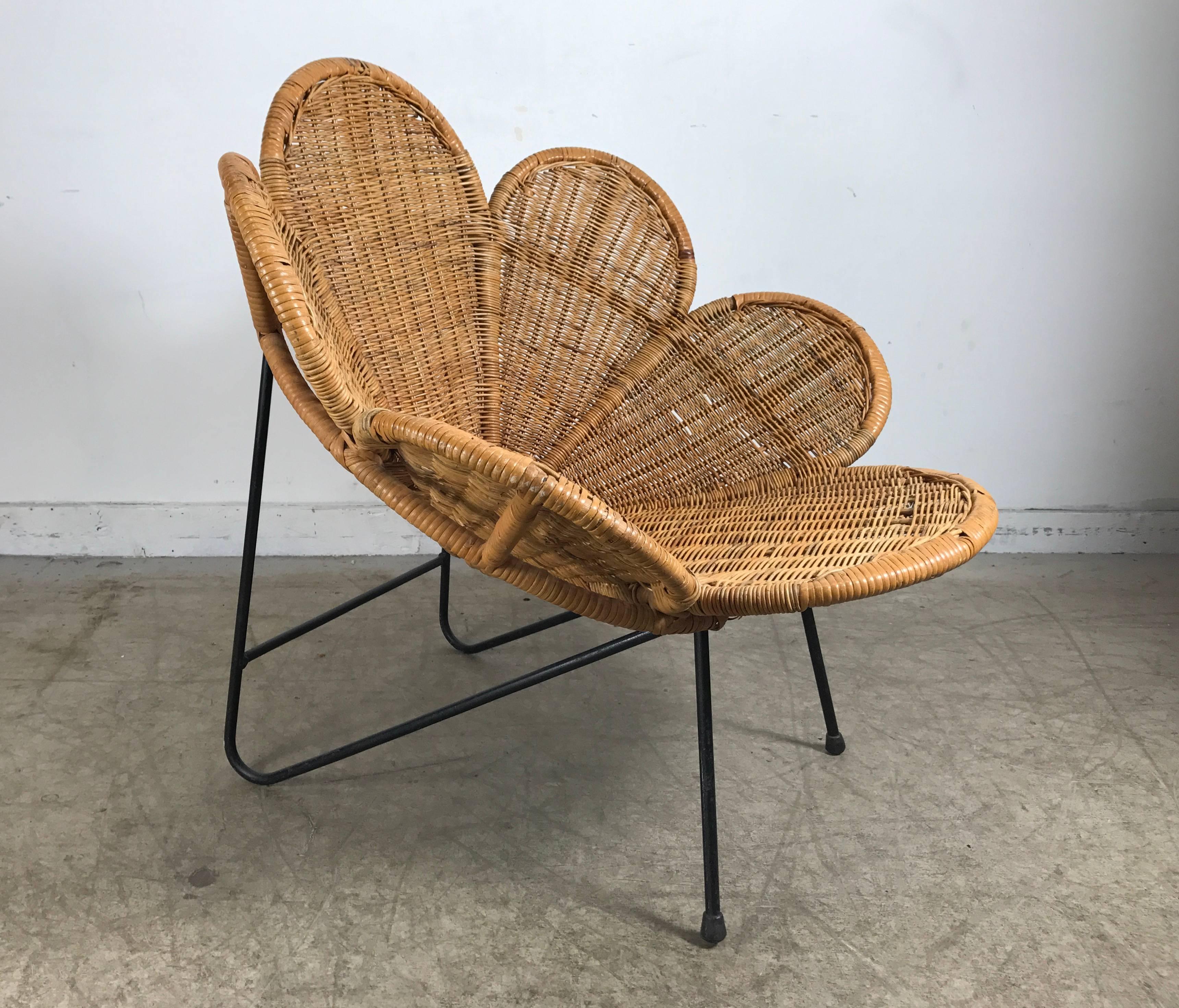Unusual modernist wicker and iron Lotus chair. Nice quality, heavy iron base, wicker and bamboo top.