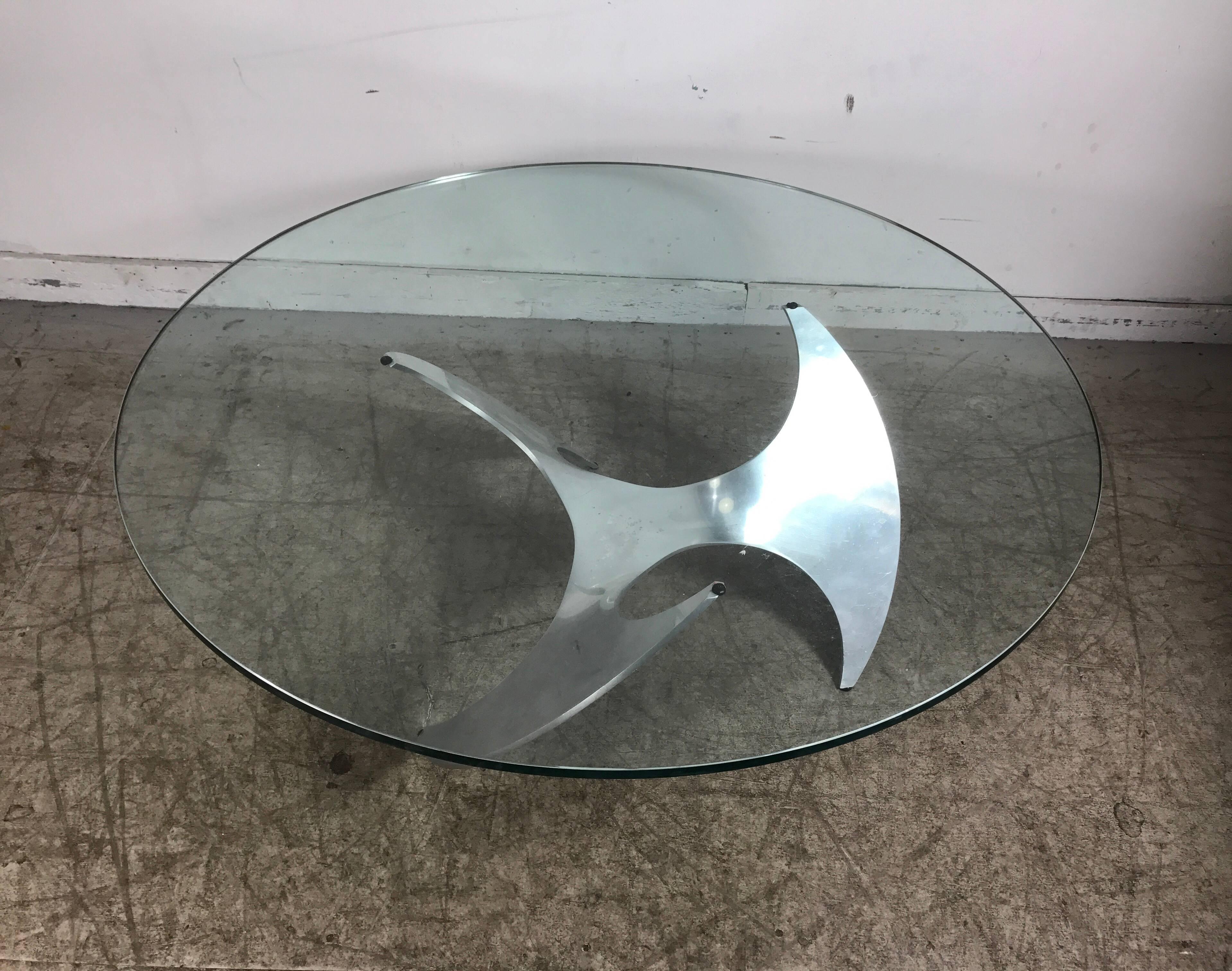 Modernist coffee table with cast alumimum propeller base Features 44 diameter, 1/2 inch thick round glass top. Designed by Knut Hesterberg. Hand delivery available to New York City or anywhere en route from Buffalo NY.