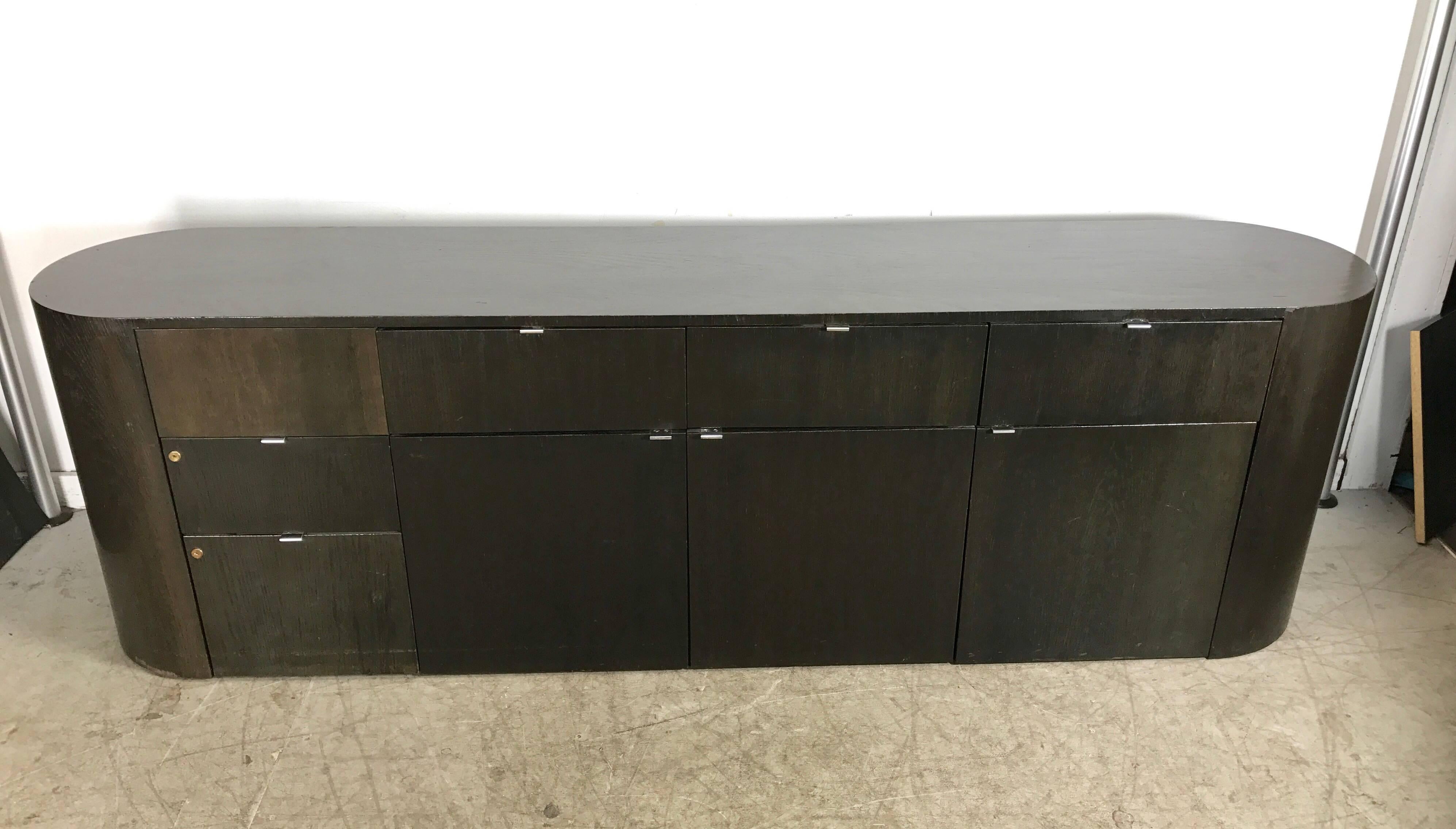 Contemporary Modernist Oval cerused credenza/sideboard, Made in Italy, Simple, sleek design, Classic Knoll-like hand pulls, generous storage, file drawer, doors/shelves, drawers, Superior quality and construction.