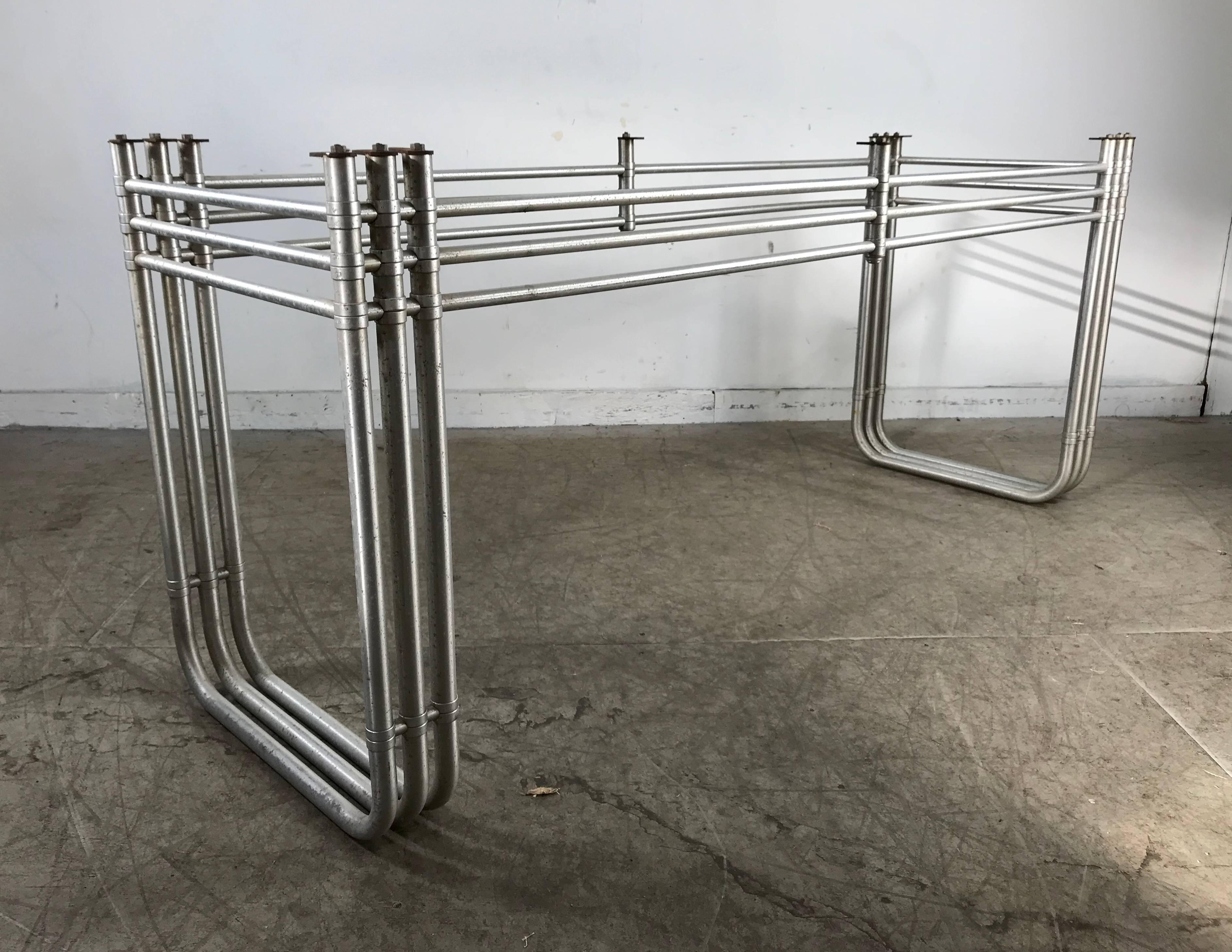 One of Warren McArthur's most elegant designs, triple banded aluminum console table base .Wonderful early example, becoming increasingly more difficult to find. Custom-made top available (inquire) Aluminum in nice original condition, minor