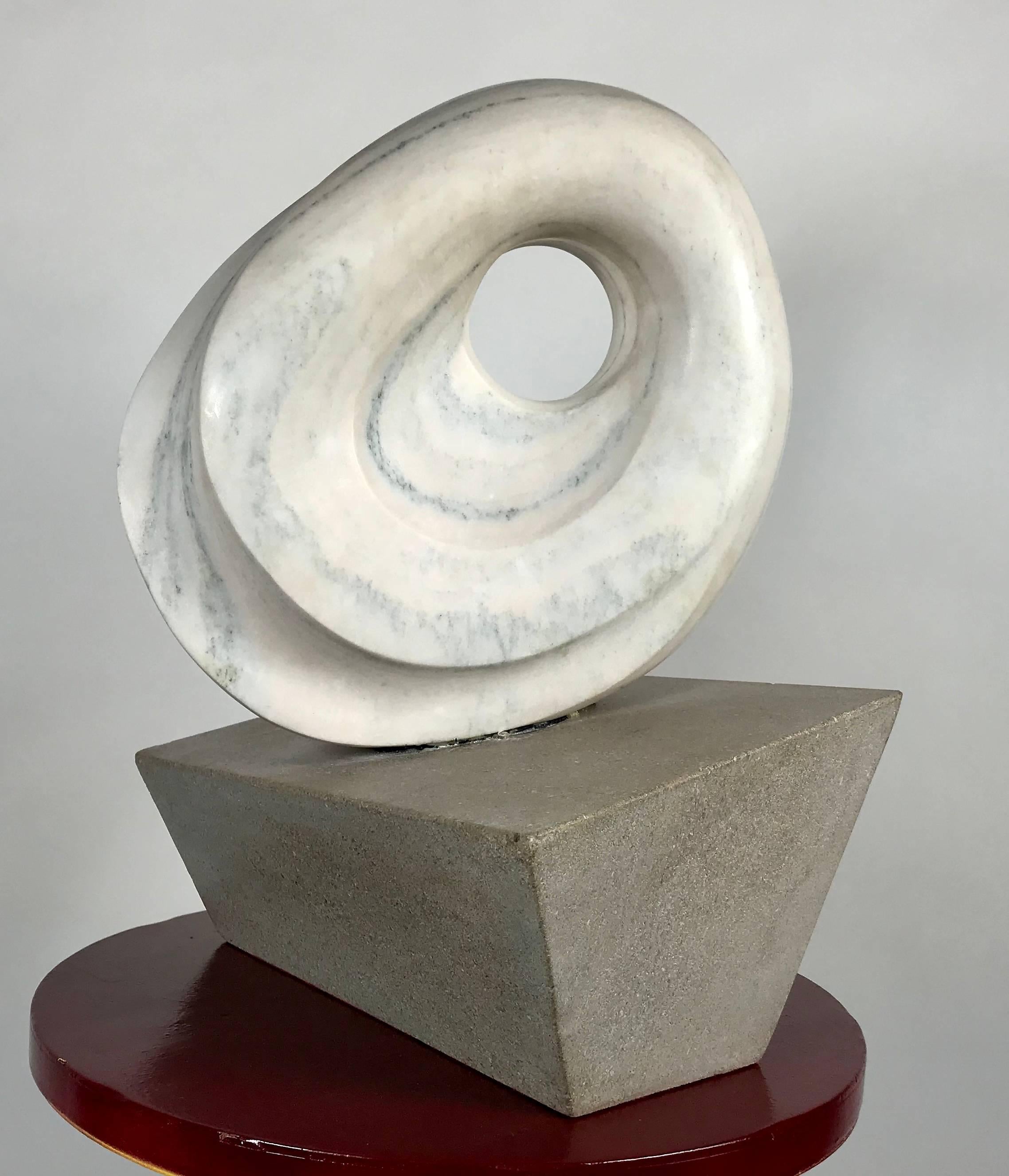 Modernist marble and stone sculpture by David F. Soule, hand-carved, wonderfully executed, trapizoid shape stone base, mounted carved and polished marble sphere, stunning.