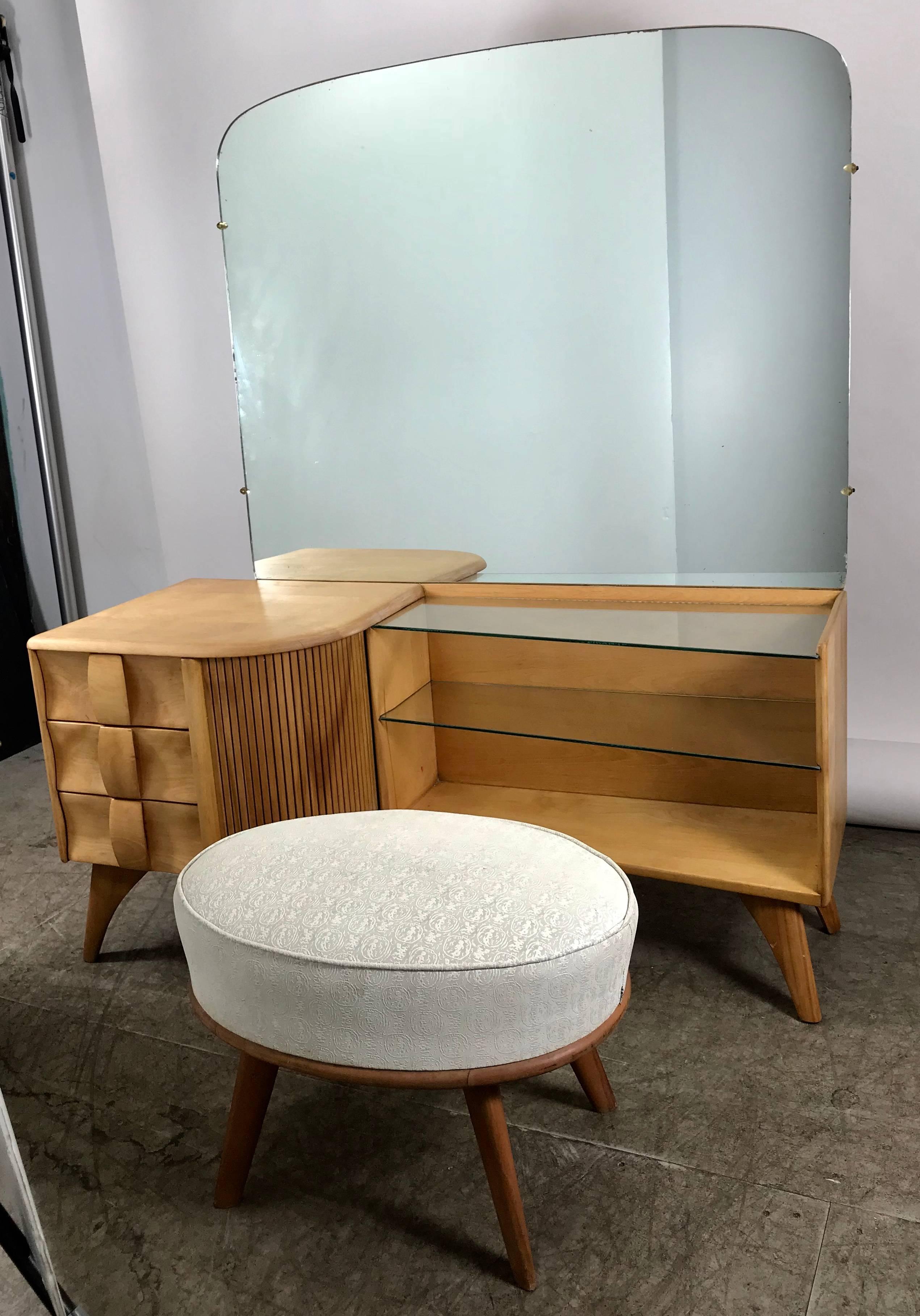 Classic Heywood Wakefield Mid-Century Modern vanity, dressing table. Beautiful refinished solid birch wood, oiled rubbed finish, features amazing sculpted drawers, tambour door, two glass shelves, large mirror. Hand delivery avail to New York City