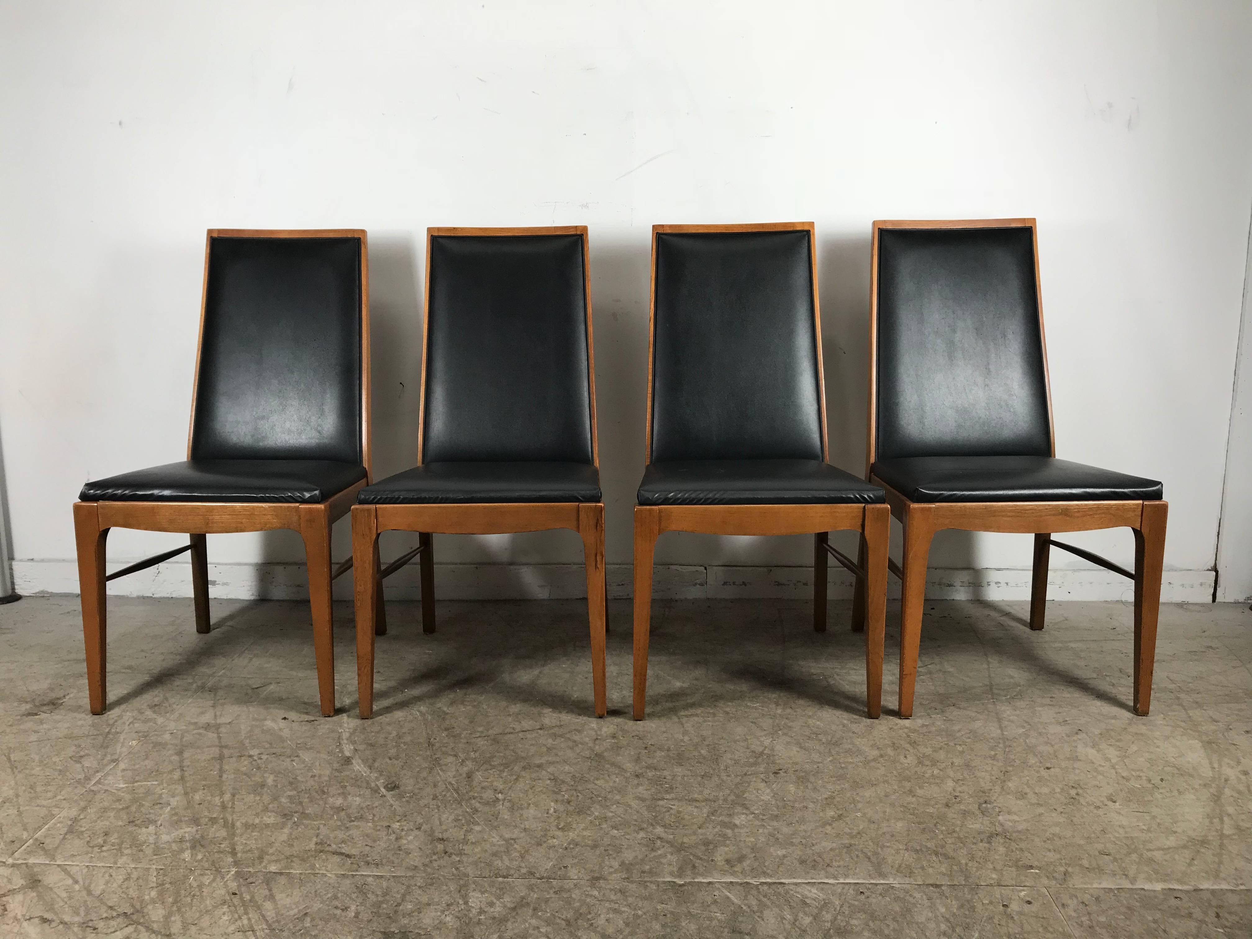 Set of four modernist walnut dining chairs by Lane Classic, simple elegant styling, solid walnut frames, Sturdy, tight joints, extremely comfortable. Hand delivery avail to New York City or anywhere en route from Buffalo New York.