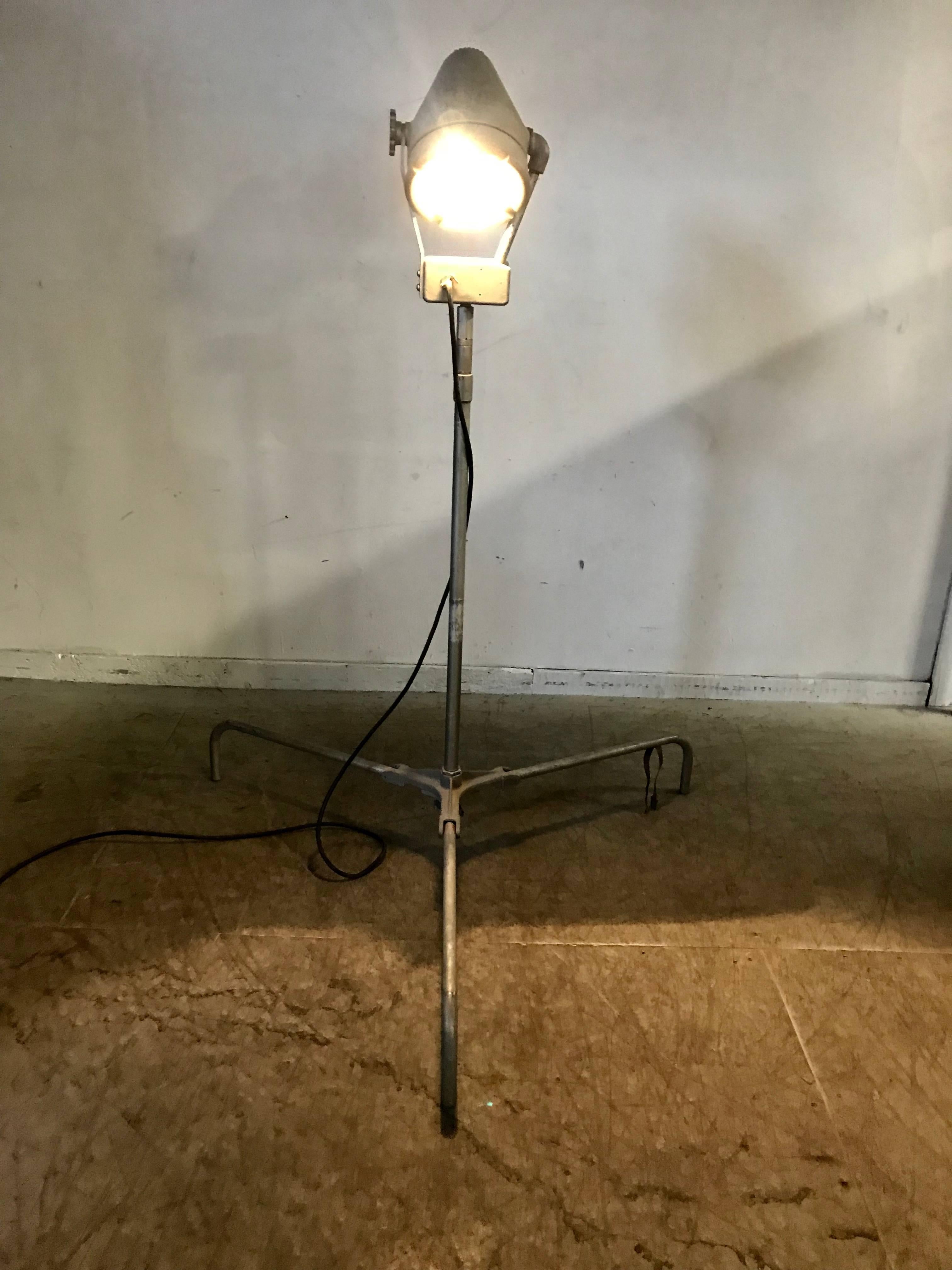 Industrial Cast Aluminum adjustable floor lamp,,Wonderful design,,bullet lamp head,Surely inspired by Buck Rogers modernist streamline design.Lamp adjustable in height from 70 inches in height to over 10 feet fully extended,Tripod  Legs can be