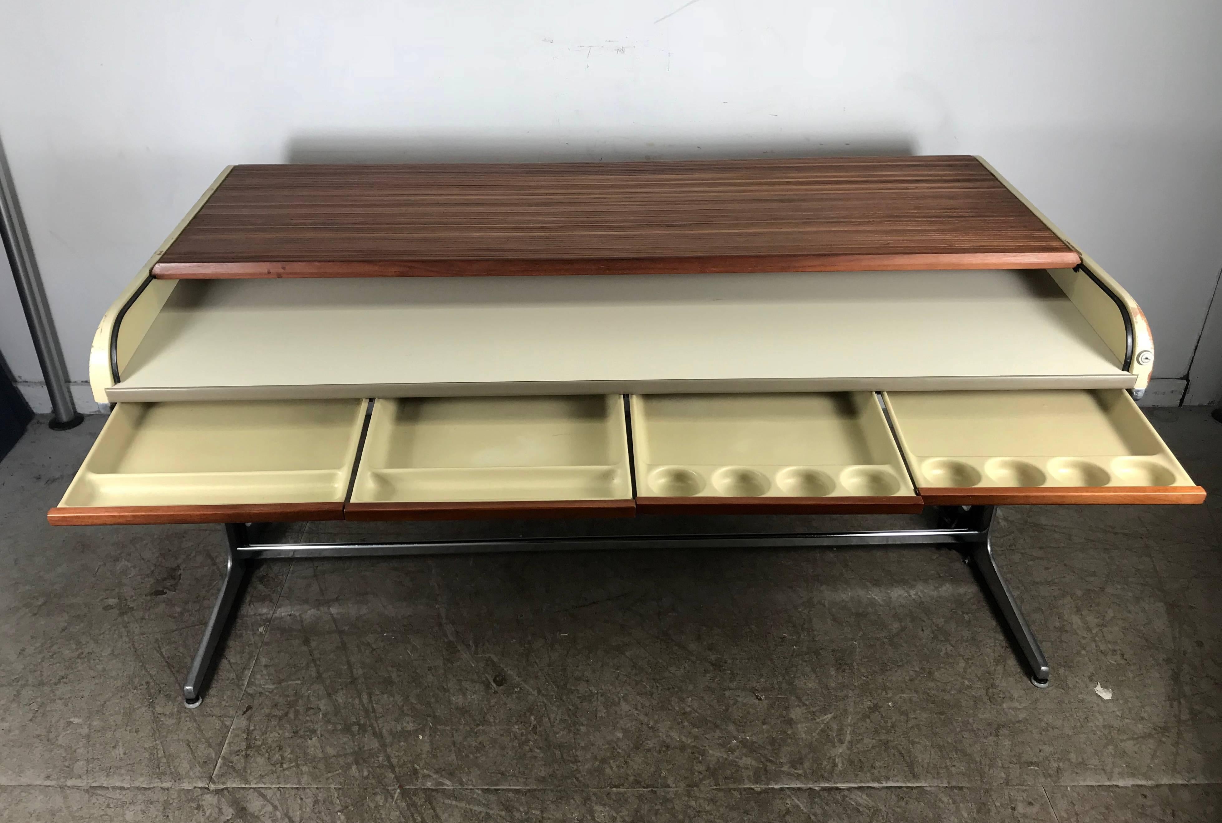 Early modernist George Nelson roll top desk. Purchased from prominent Buffalo New York architect, retains original cream lacquer wood finish, amazing original finish, warm rosewood tambour roll top, cast aluminum base. Hand delivery avail to New