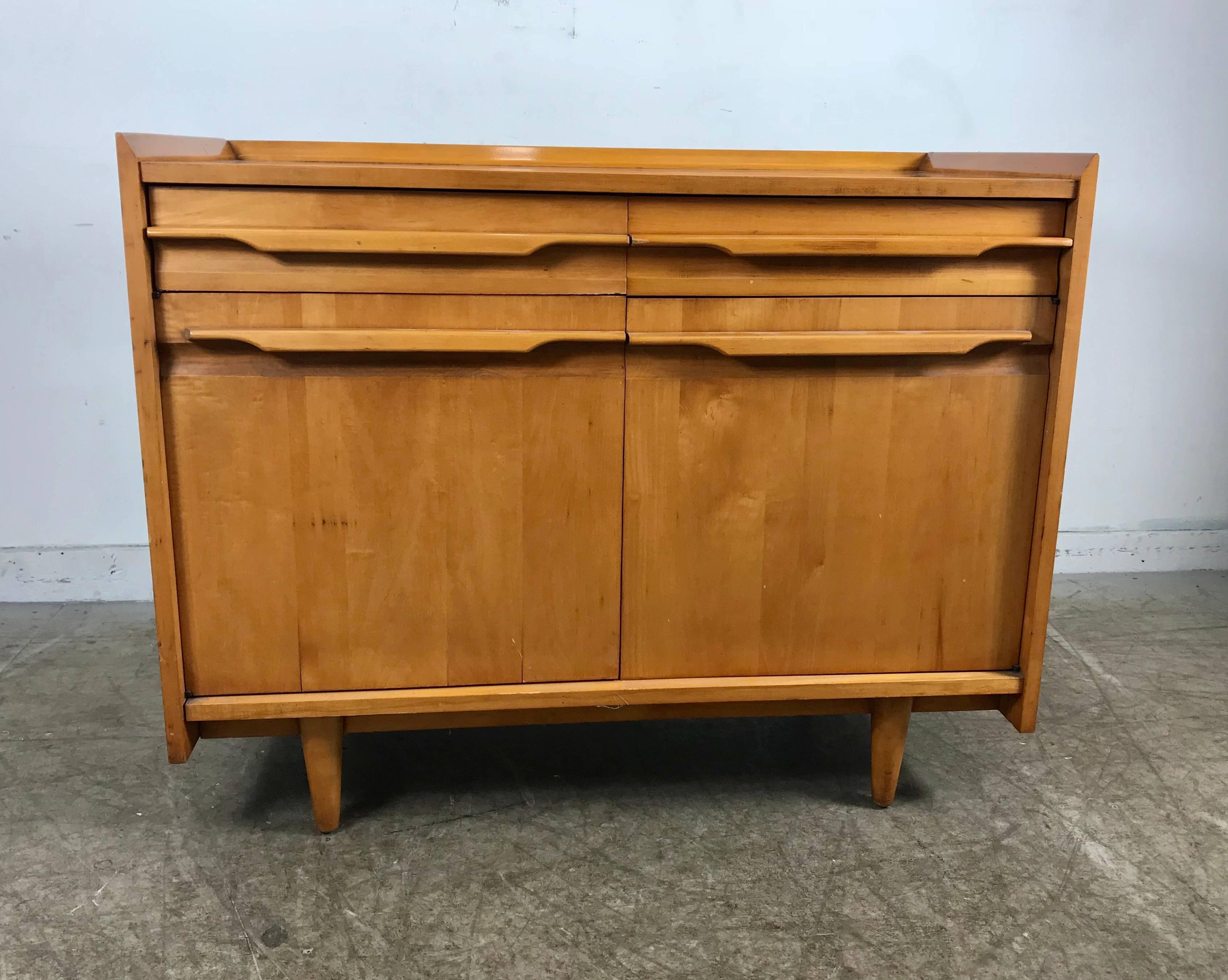 Handsome Modernist Solid Blond Birch Woo.  Two Door,Two Drawer Cabinet by Crawford Furniture ,Jamestown Ny. Classic Style,,wonderful sculpted hand pulls,Great size,scale and proportion. Hand delivery avail to New York City or anywhere en route from