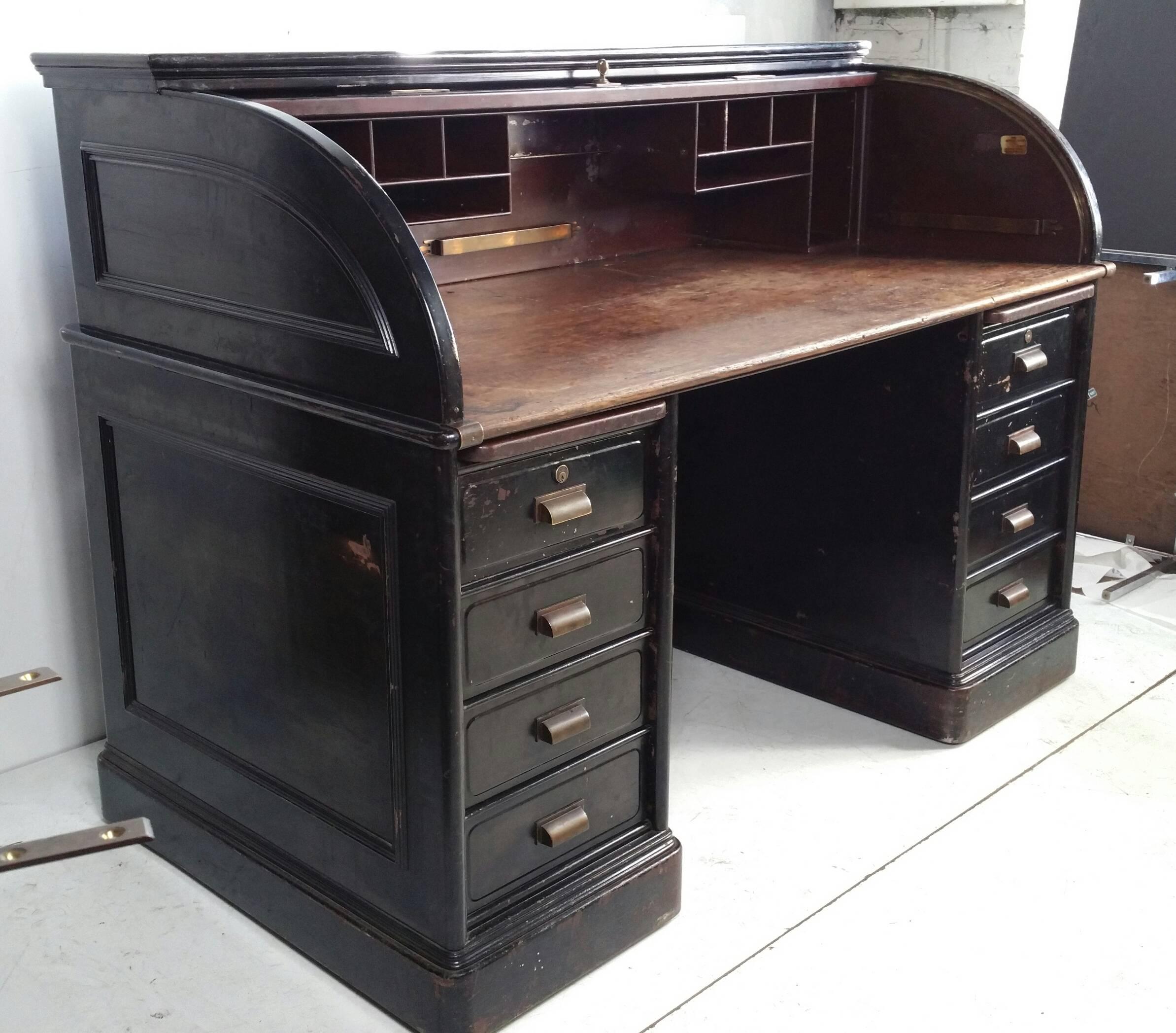 Monumental Industrial steel roll top desk manufactured by Fenton Metallic, the early maker which became Art Metal around the turn of the century, desk features beautiful quarter sawn oak desk top (rarely seen) Wonderful brass hand pulls as well as