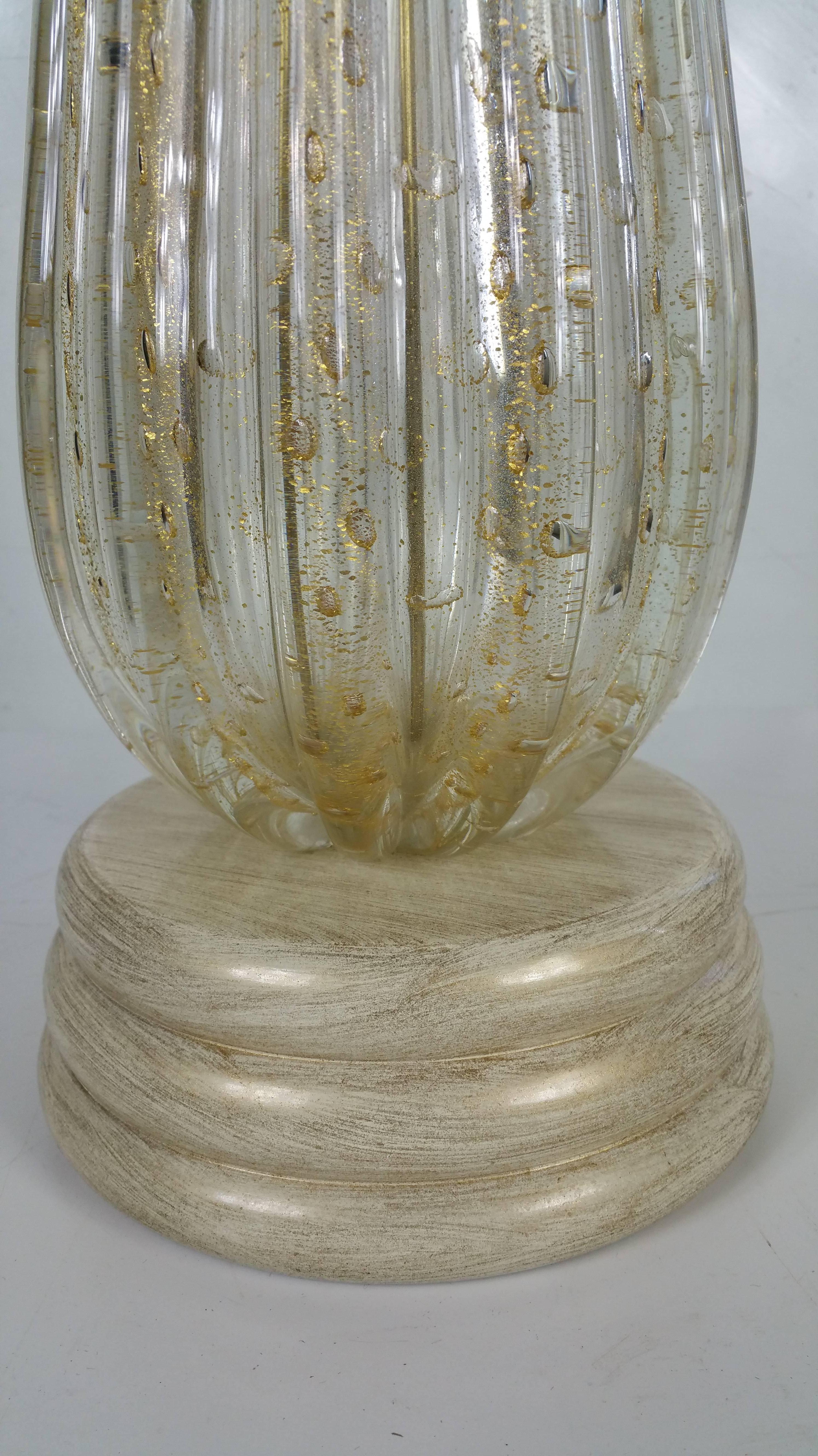 A lovely vintage Murano lamp of clear ribbed glass with controlled 