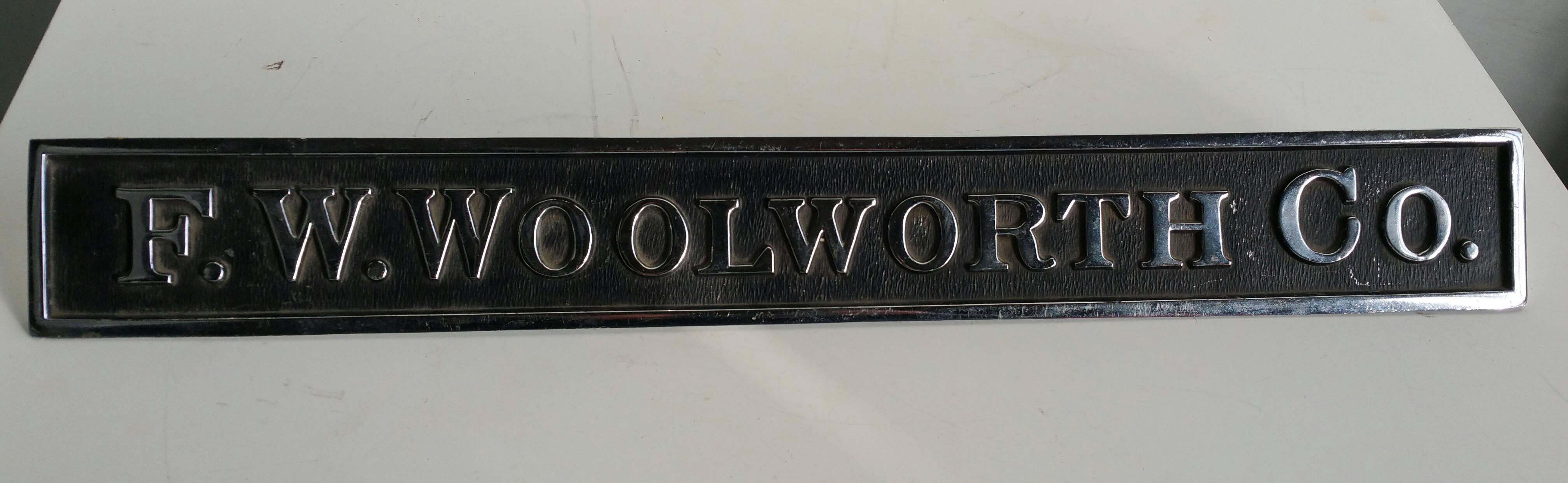 Great little decorative item,, Period F.W.WOOLWORTH CO. counter sign made by NU-LITE DISPLAYS.. Nickel plated steel and painted..