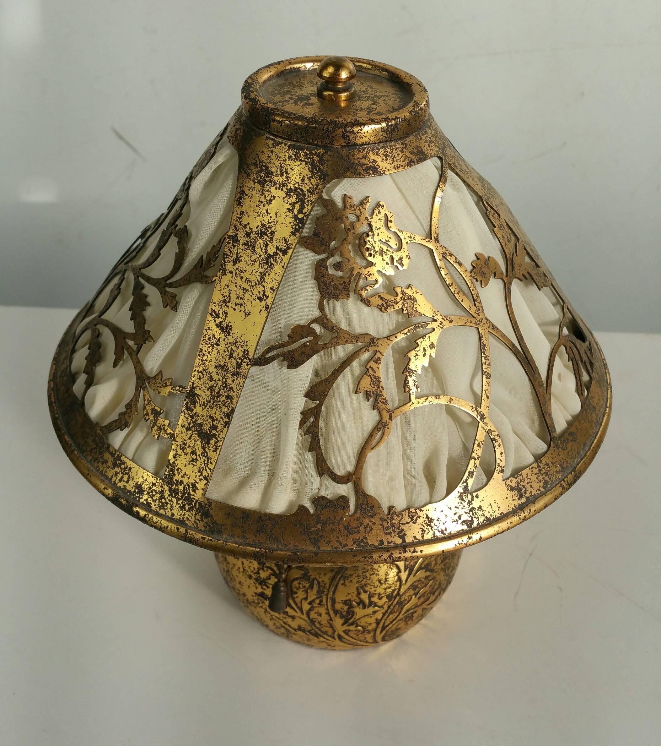 Nice little silvered bronze boudoir lamp made by Heintz Metal Arts,, Retains original silk shade,, minor dent to decorative bulbous body,