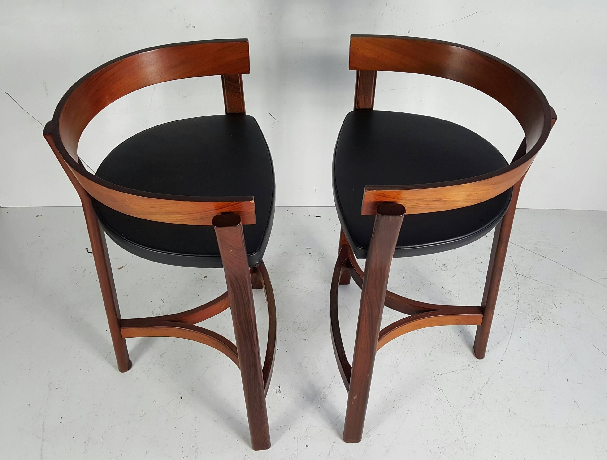 A nice vintage pair of barstools by Eric Buck for OD Mobler Denmark. Produced in solid rosewood with foot rests. Manufacturer labels to both.