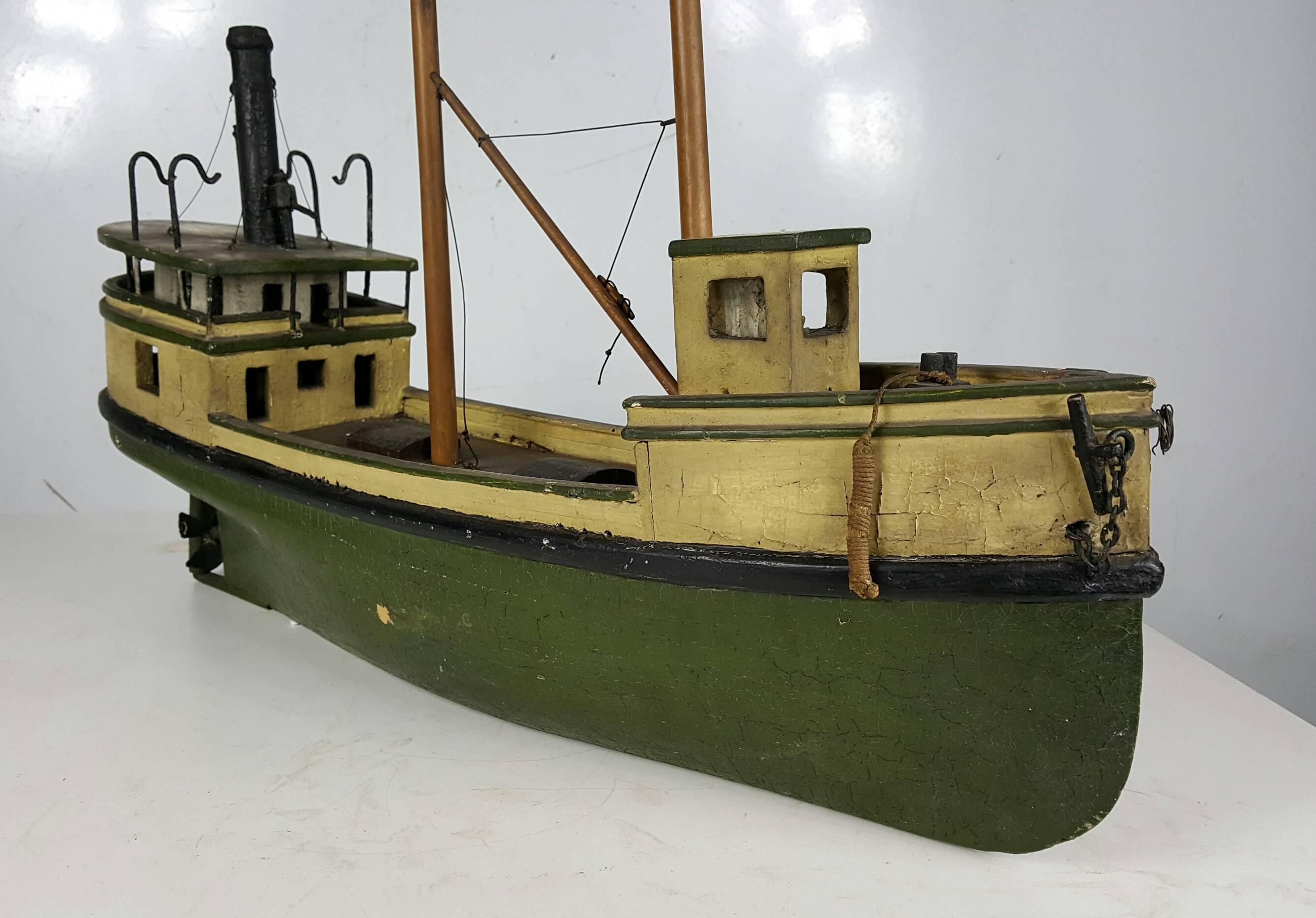 Great little decorative item,, Hand made fishing boat, done around 1910-1920..Wonderful details,retains ships wheel, propeller,masts,,fishing pole. rudder, Amazing finish and color..Art Deco Style..