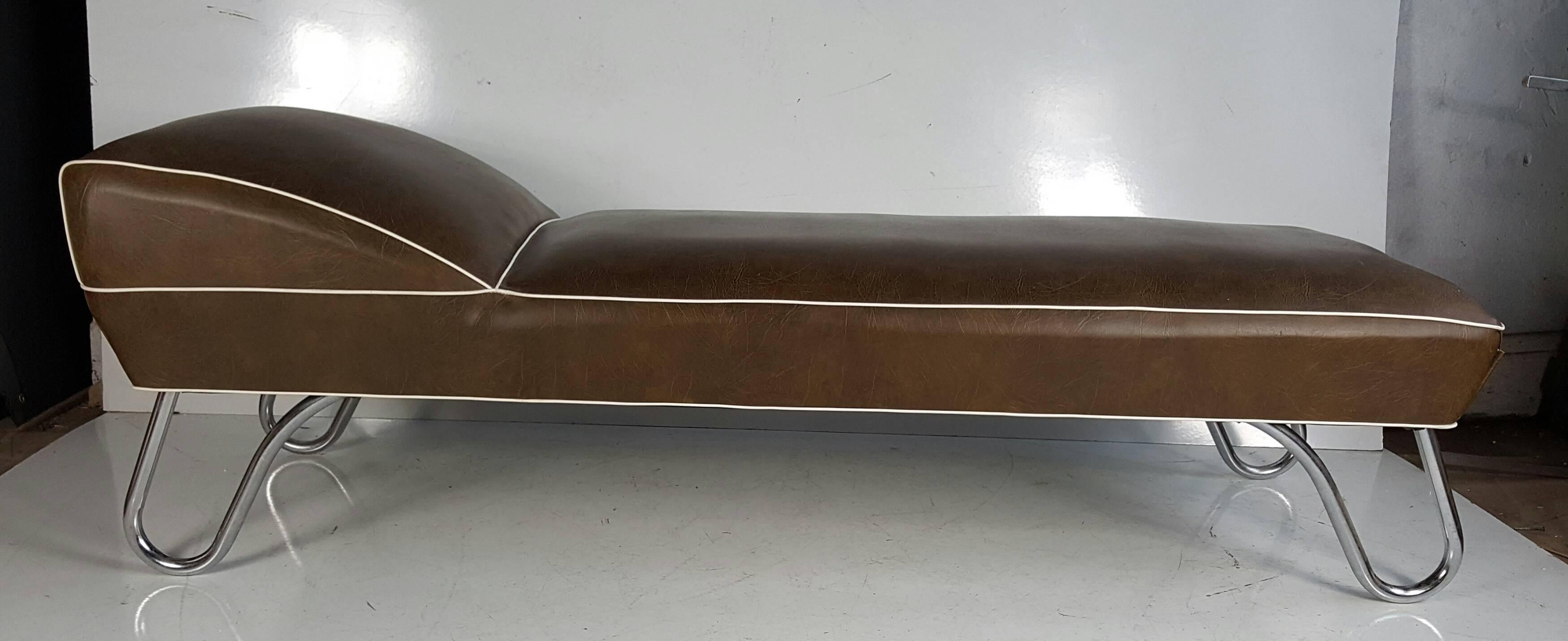 Daybed upholstered in brown vinyl with white trim. with tubular chrome legs.Classic Art Deco design,,