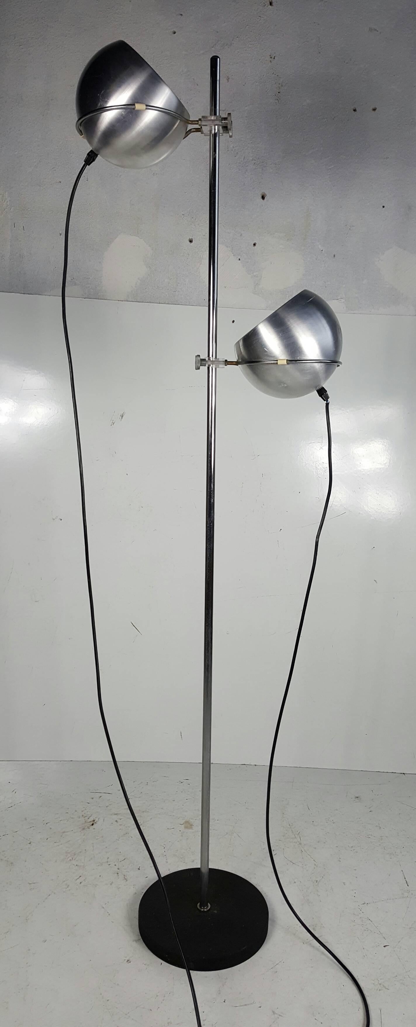 This chrome floor lamp was designed during the 1960s, and manufactured in the Netherlands by Gepo.K & H Norway.. It is made from chrome lucite adjuster details,,,  features two independent adjustable ball-shaped shades .