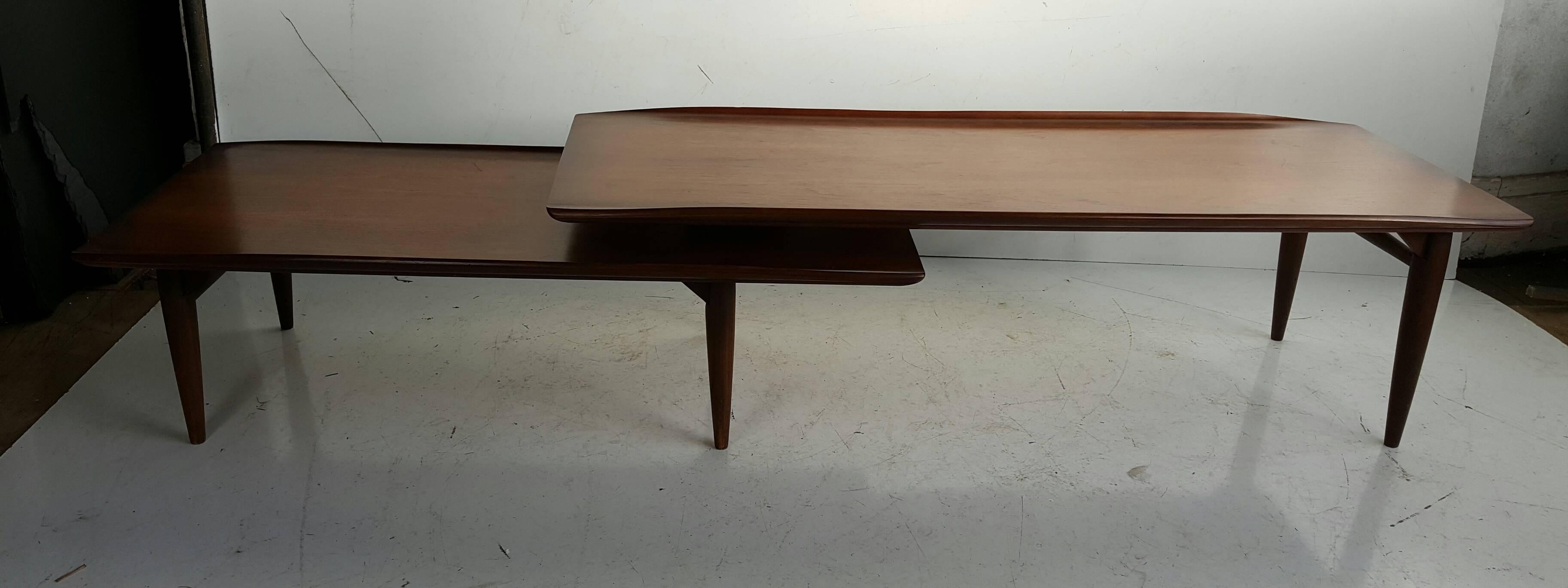 Rare version of the classic Lane cocktail table,, Solid figured walnut,Two-tier pivoting swing out,,Table measures 51