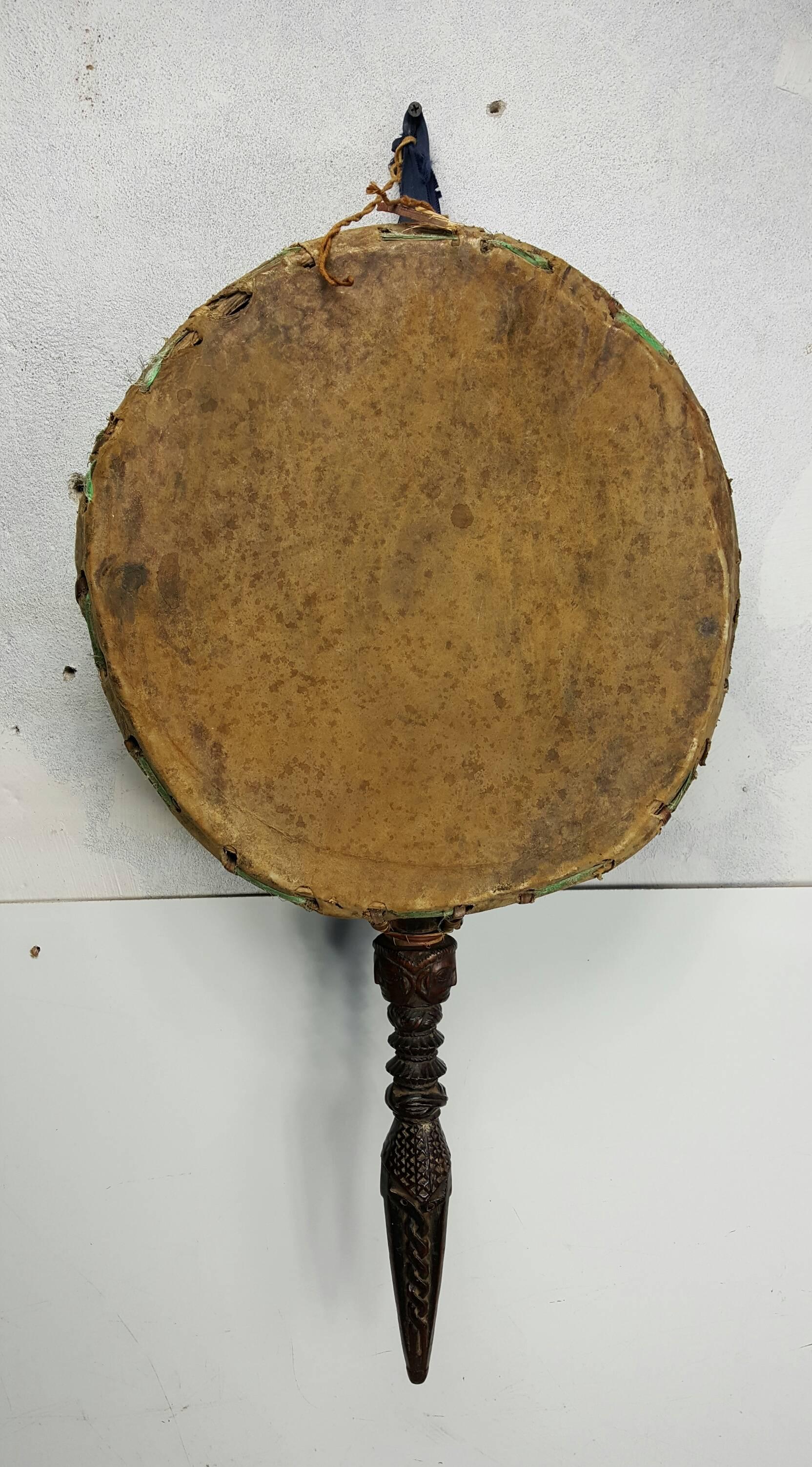 This is a traditional drum used by the Dhamis, or Shaman Medicine Man, of the Himalayas. This drum is handcrafted in Nepal. The healing drum is a large two-sided drum, measuring about 15 inches across the drumhead x 6 inches thick. The wood is