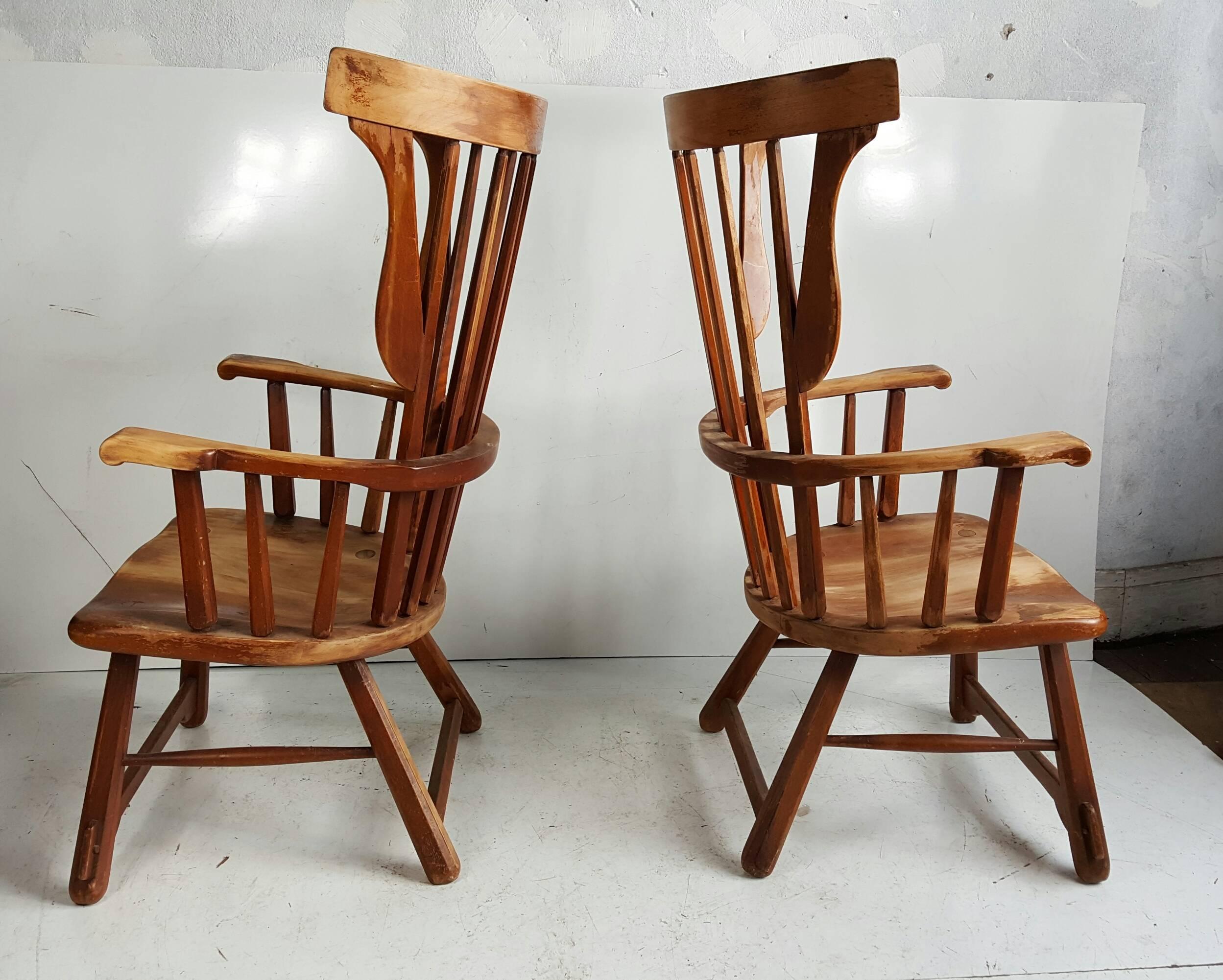 Pair oversized Crafts Colonial arm chairs,, Solid maple wood construction,,Almost cartoon-like proportions,,Interesting mortis and tenen construction.Extremely comfortable.
