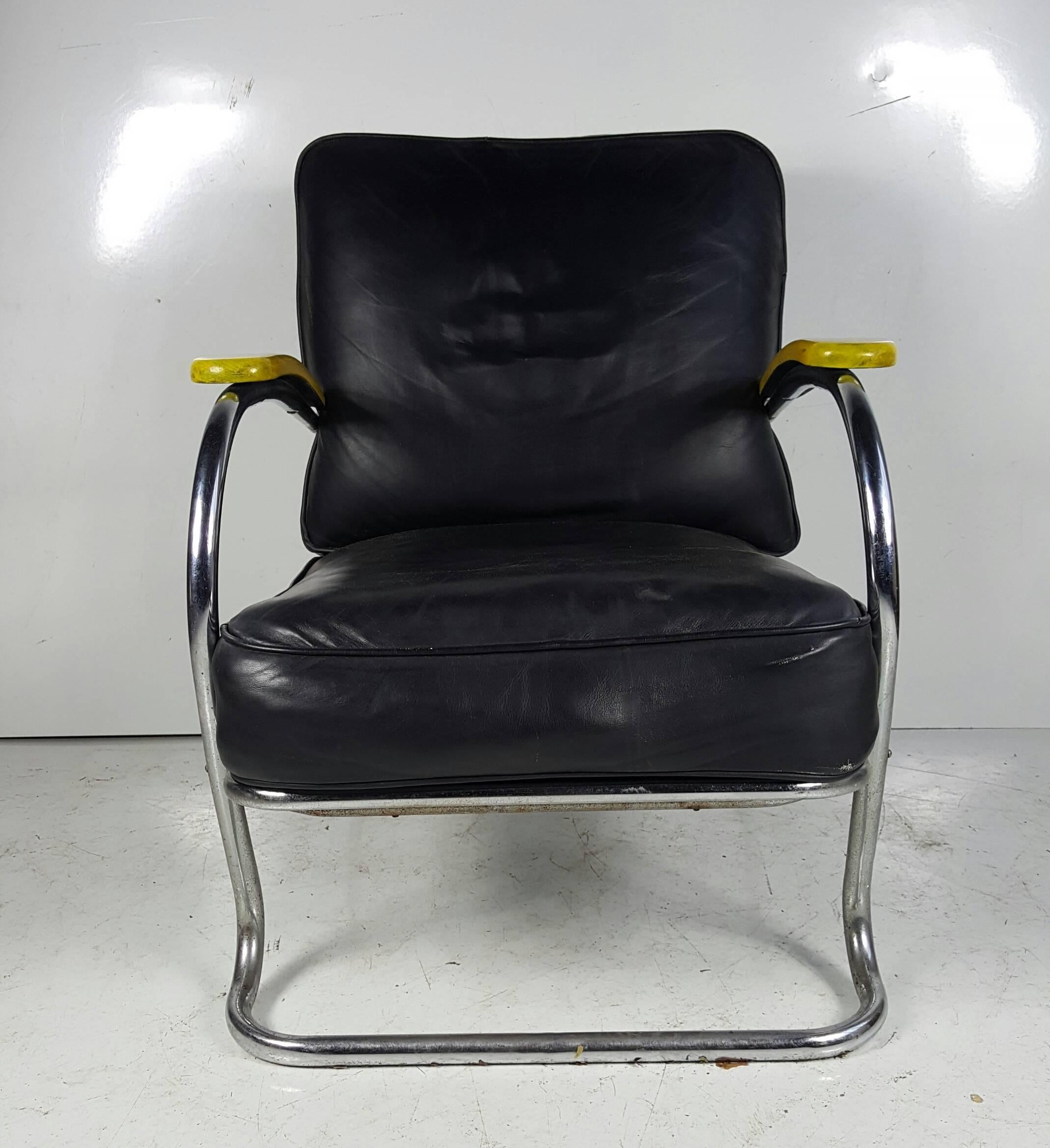 Art Deco chrome and leather KEM Webber lounge chair, circa 1930s, manufactured by LLoyd, Classic Deco design, electric yellow lacquered arms, extremely comfortable.