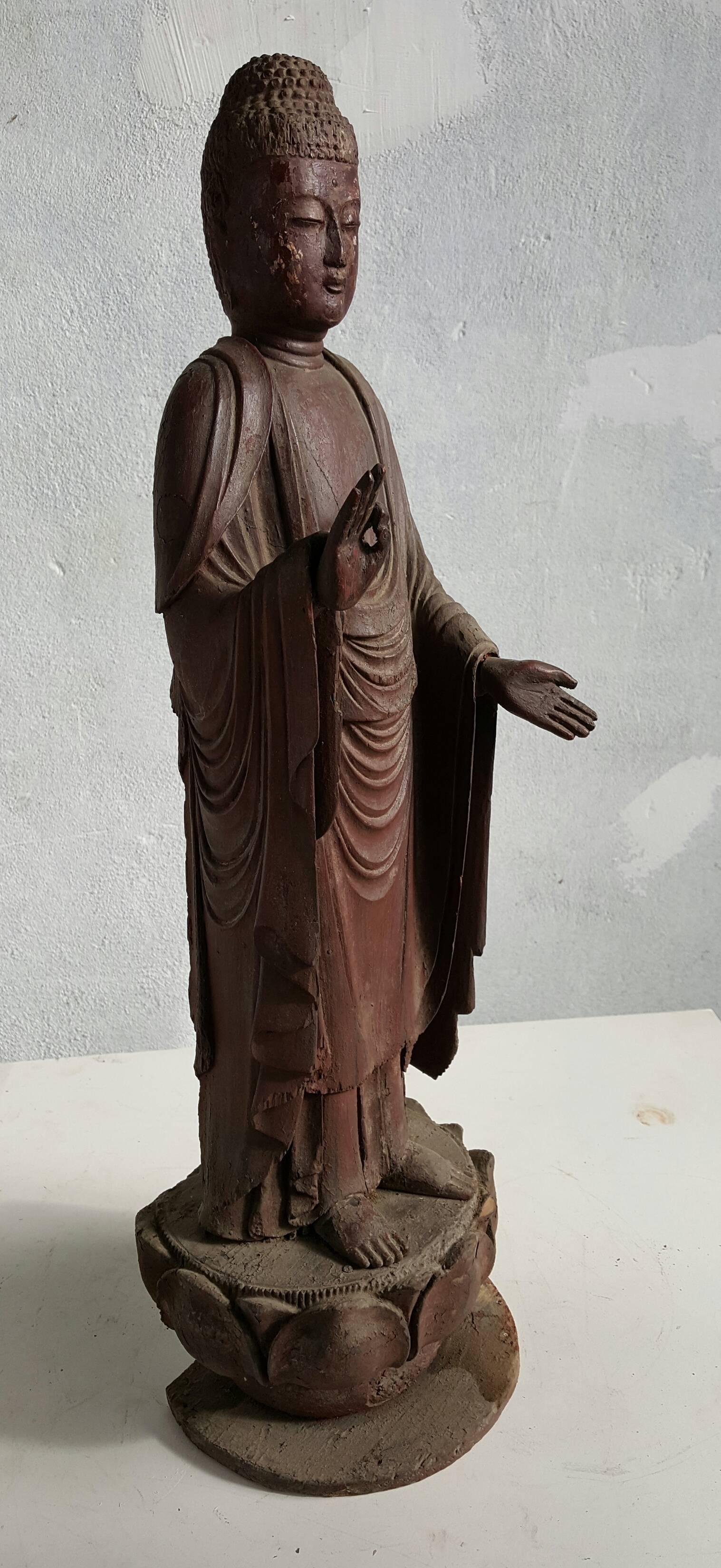 A Japanese carved wood Buddha figure Amida Nyorai (Buddha Amitabha),Mid 19th century, Cypress wood with traces of pigment and lacquer gold leaf. Standing on a lotus Zishi . This masterpiece is exquisitely caved. From the draping of the robes and the