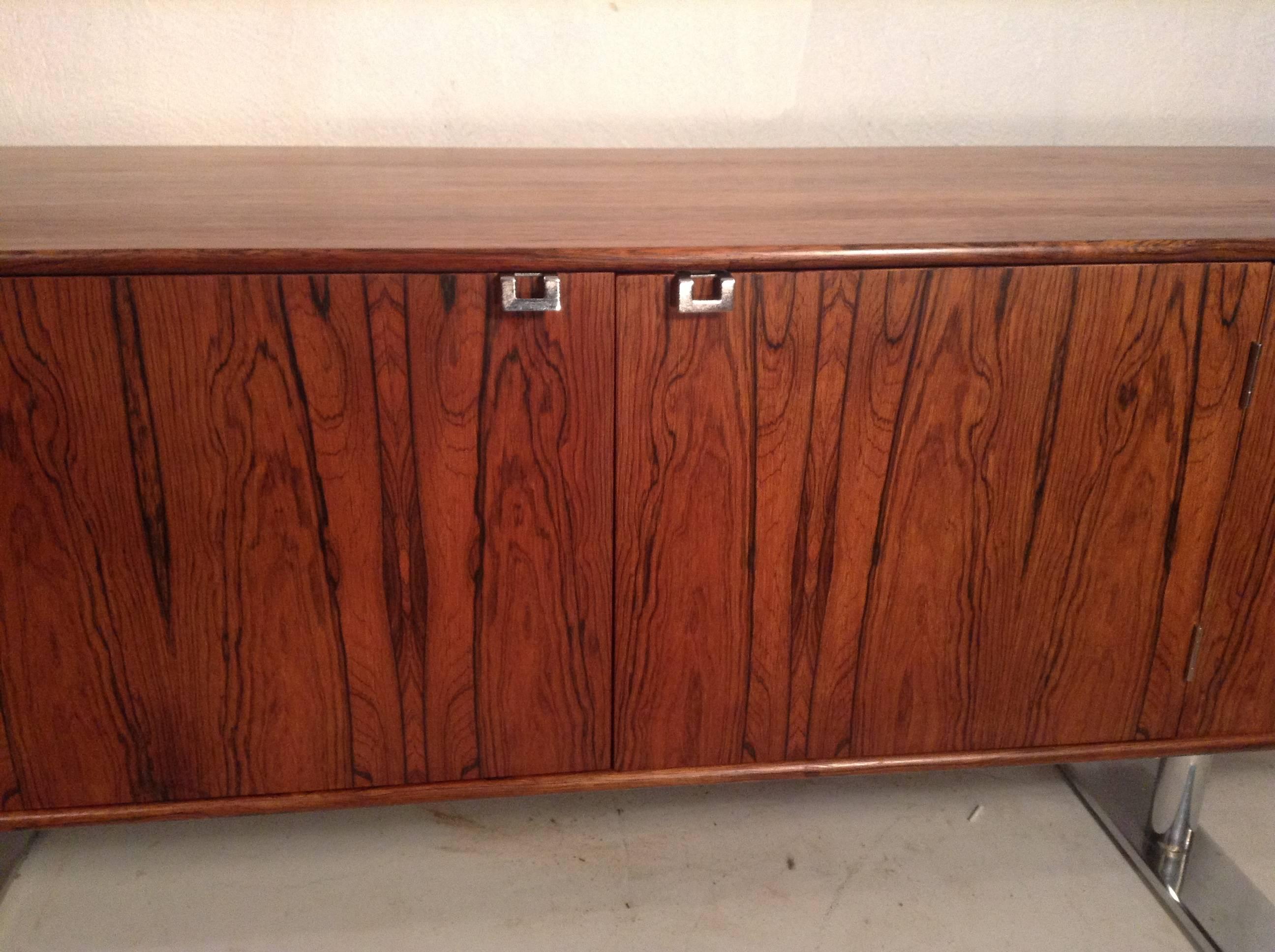 A bench made rosewood credenza with
stainless steel base. This Classic Leif
Jacobsen 