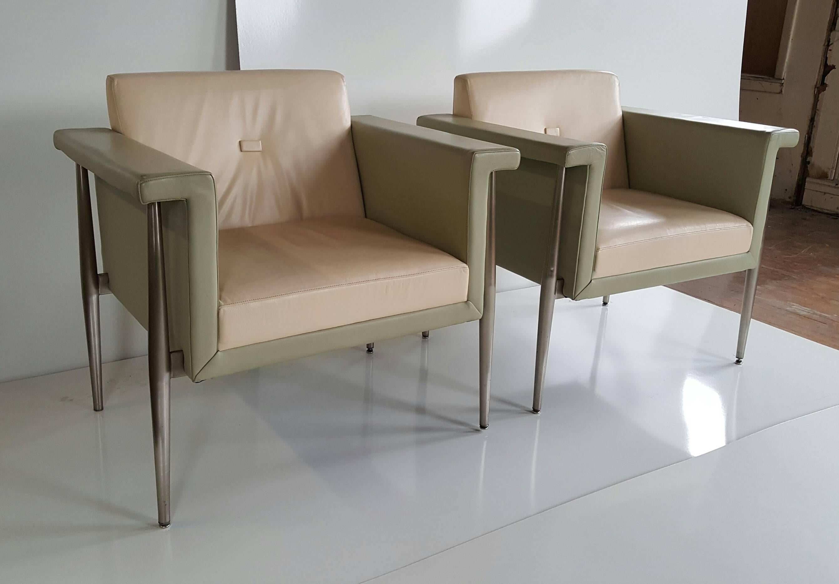 Sleek, elegant pair of modernist. Memphis style lounge chairs manufactured by Berhardt Furniture, U.S.A. Quality soft, supple leather, soothing colors extruded aluminum frames.