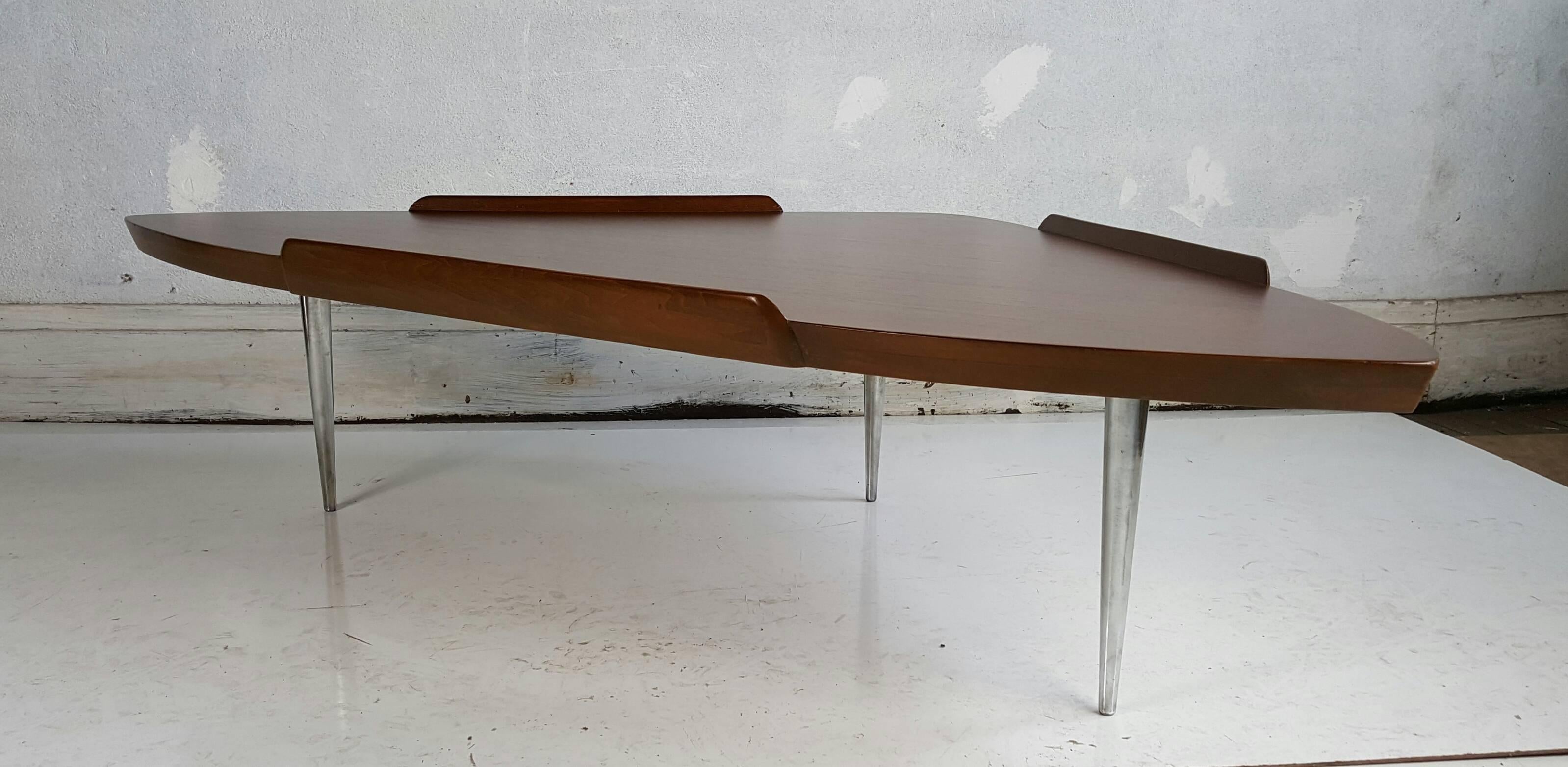 Unusual modernist cocktail table, guitar pick shape, versatile form for optimal convenient use, manner of Finn Juhl.