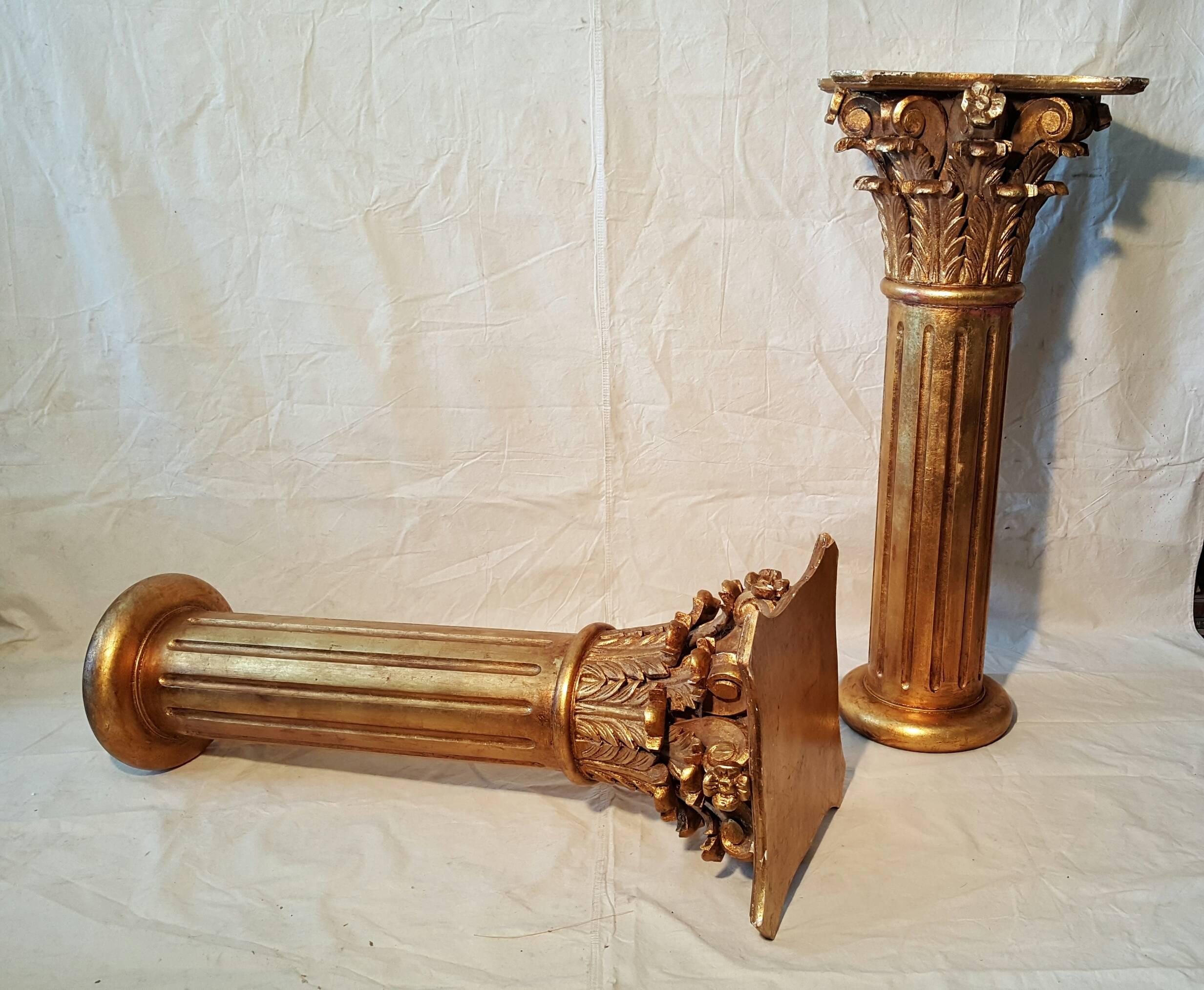 Dramatic matching pair of gold gilt carved wood and gesso pedistals, featuring fluted columns, corinthian capitals, made in Italy.