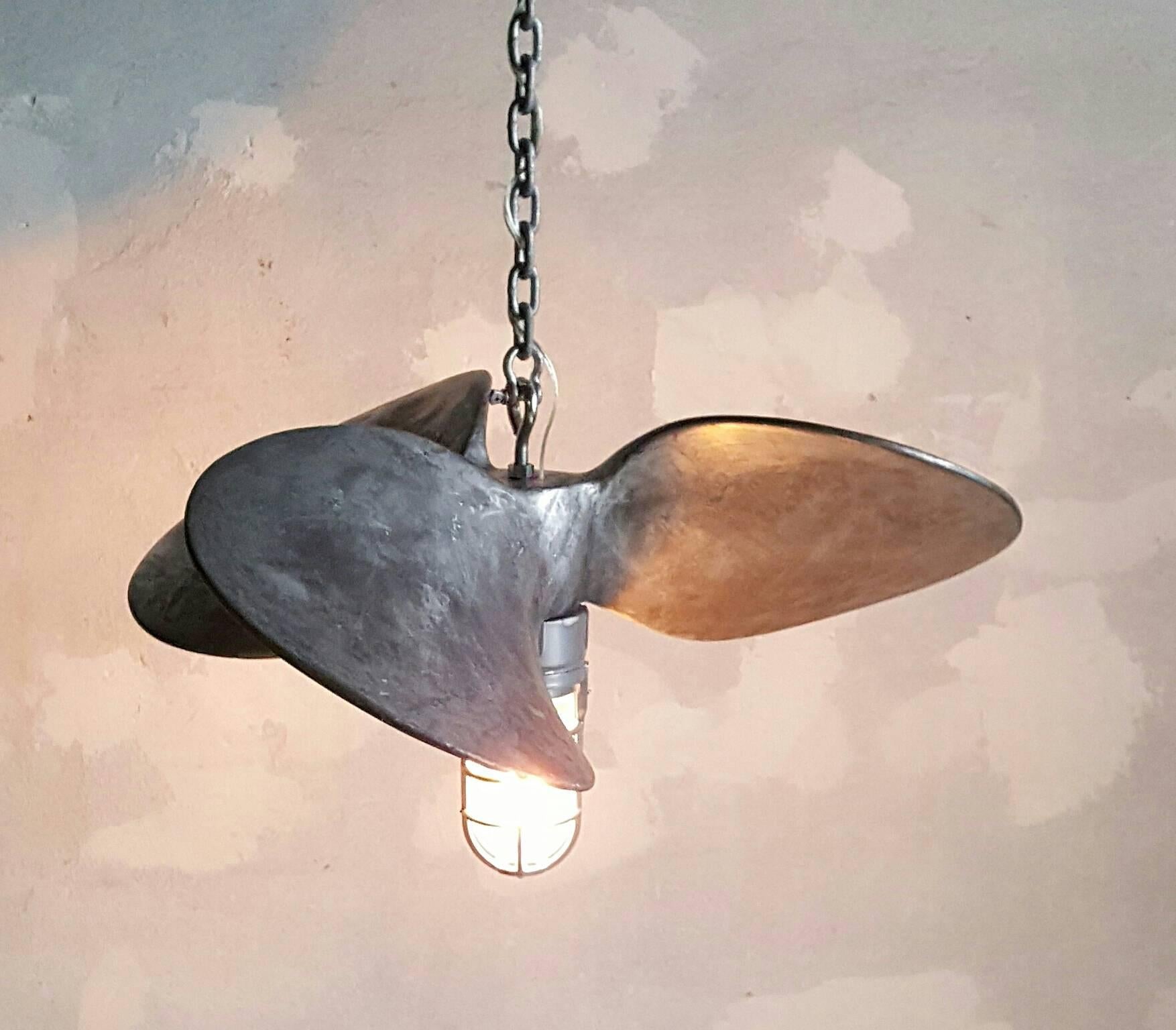 Unusual Industrial aluminium nautical propeller hanging light, wonderful patina. Explosion proof light fixture, Edison exposed filament light bulb. Perfect addition to loft kitchen. Two matching slightly smaller fixtures available.