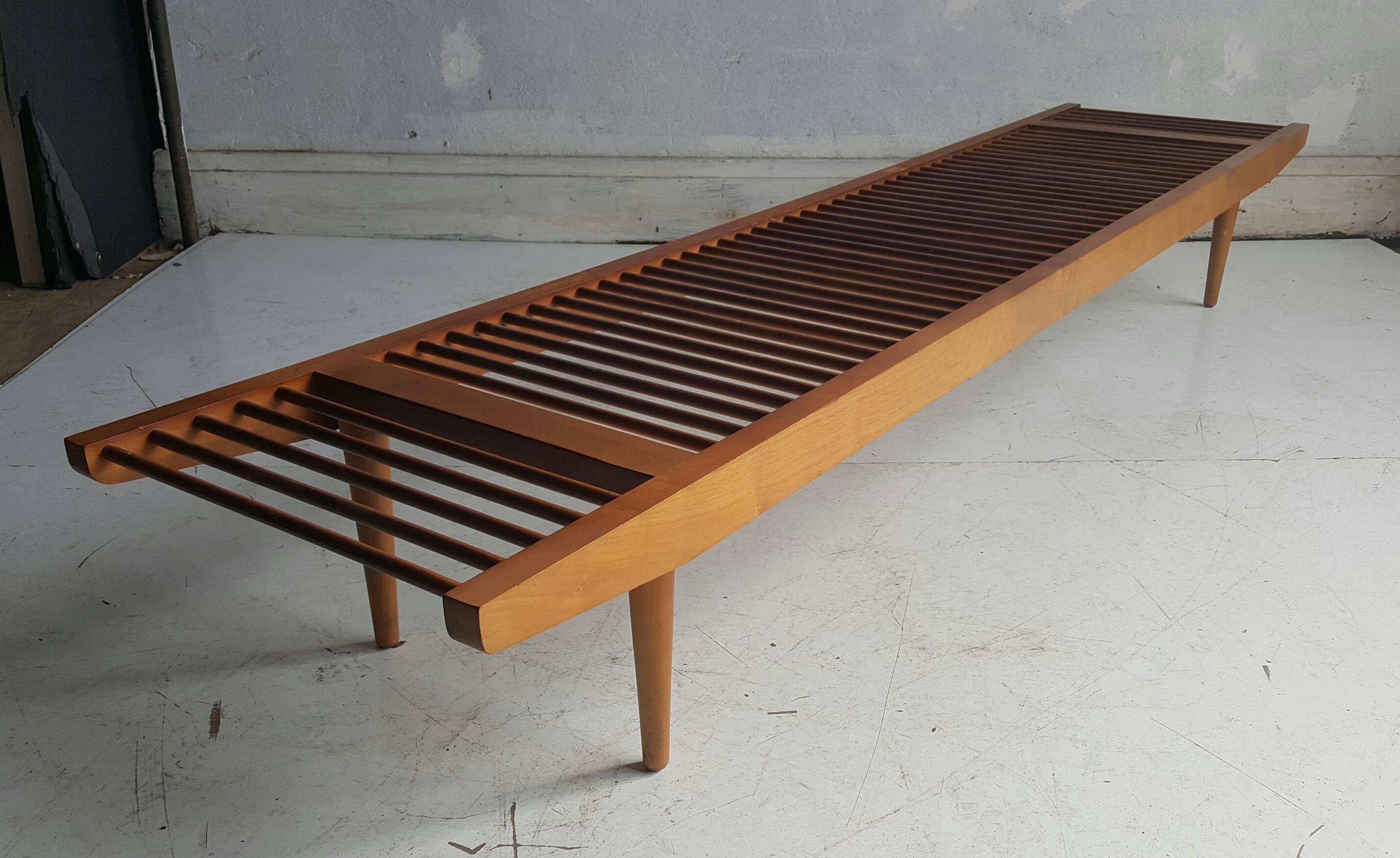 California Modern bench or coffee table, designed by Milo Baughman for Glenn of California, circa 1950s. Modernist low profile, Dowell design, can be used as a bench or long and low coffee table.