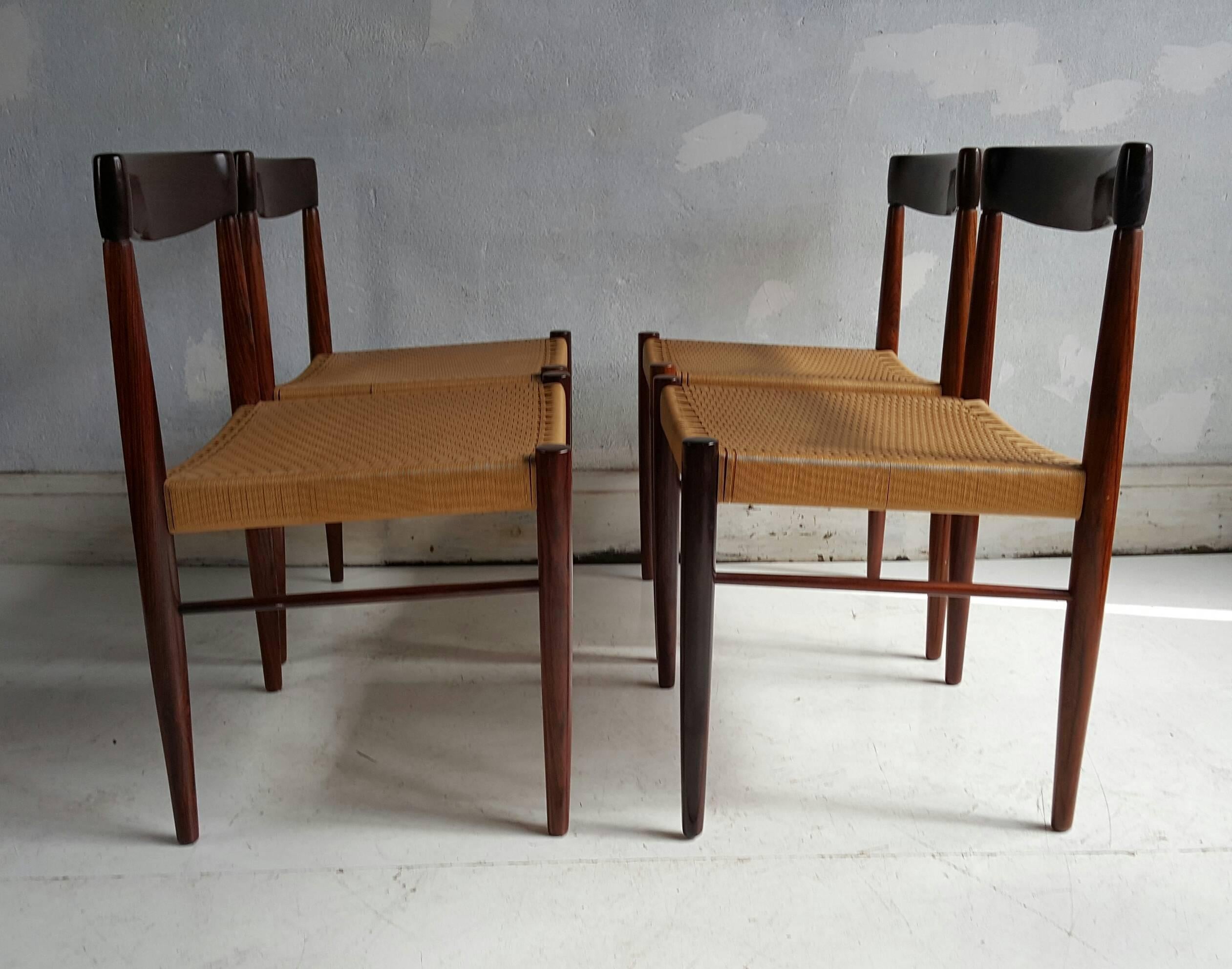 Set of four figured rosewood and rush dining chairs H.W.Klein for Bramen, Denmark. Classic, sleek, simple styling. Made in Denmark. Excellent original condition. Superior quality.