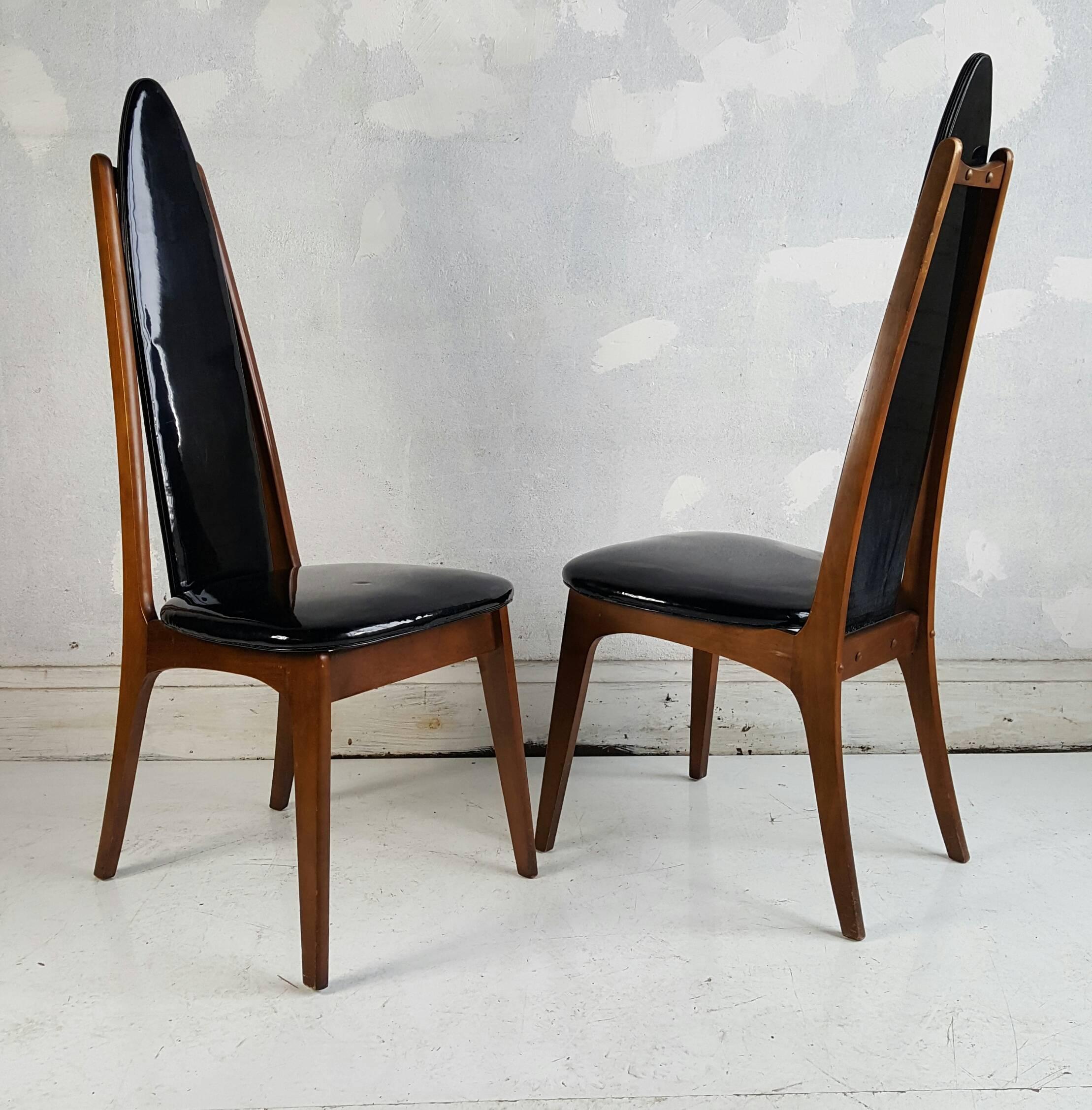 Dramatic set of four black patent leather and walnut dining chairs, Hollywood Regency, Mid-Century Modern, excellent original condition. Whimsical, sculptural design, high-back, made in Montreal.