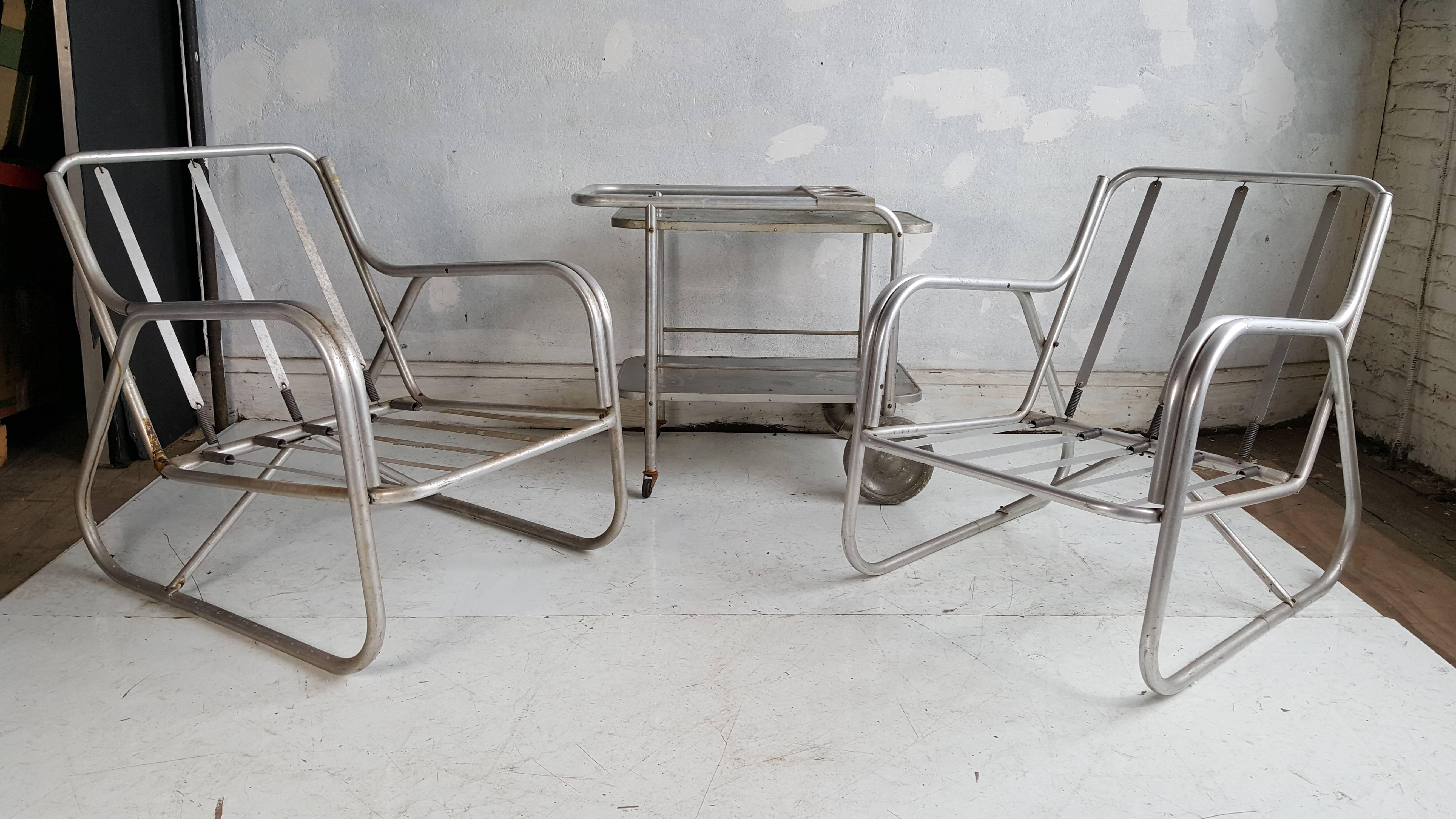 Classic Aluminum outdoor living,, Matching pair of lounge chairs and two-tier rolling bar cart, manufactured by Deeco,Craftsman in Aluminum ,California,Wonderful Art Deco ,Machine Age style.  Reminiscent of the classic sought after aluminum pieces