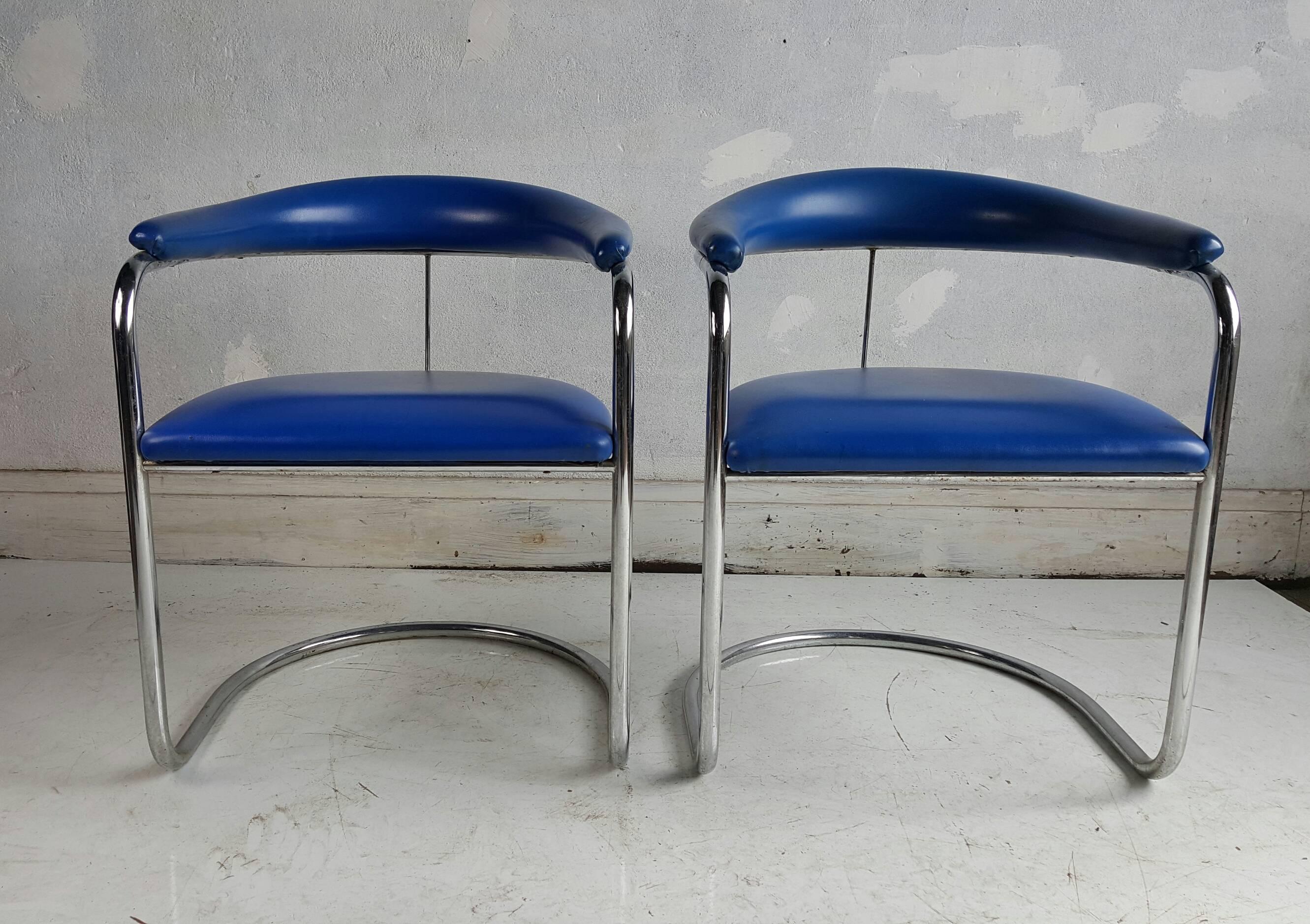 Pair of Anton Lorenz chairs for Thonet model SS33. Original electric blue naugahyde upholstery, tubular chrome cantilivered frame.